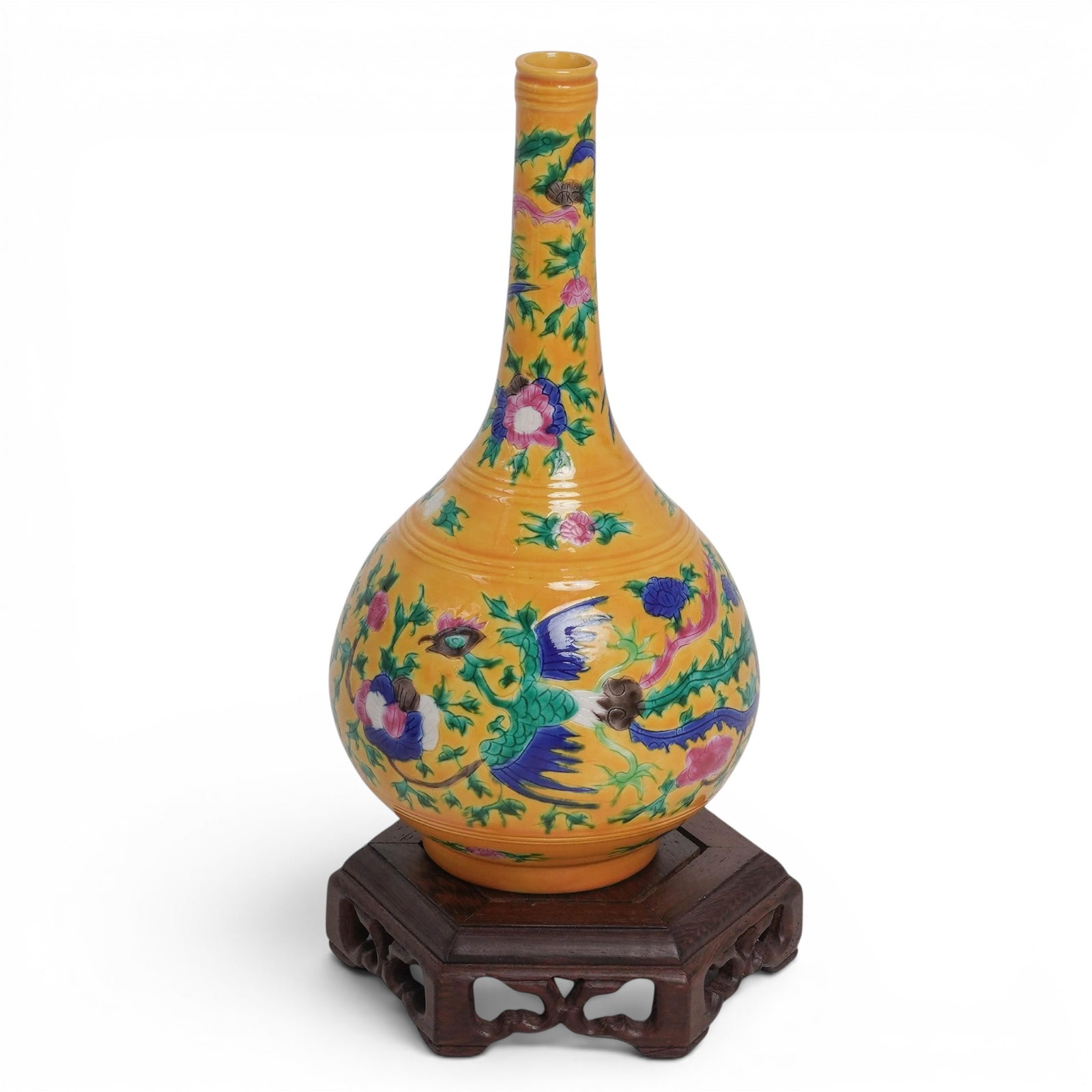 Chinese Enameled Porcelain Vase: Chinese Enameled Porcelain Vase 20th century, Chinese The body and neck feature vibrant, multicolored floral blossoms and stylized flying Dragons painted in green, blue, pink, and purple enamels over 