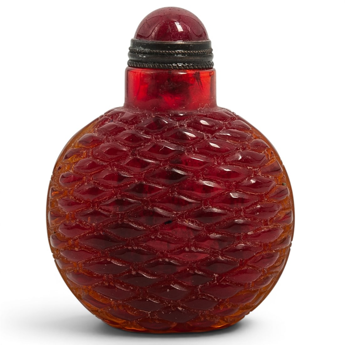 Chinese Red Basket Weave Glass Snuff Bottle: Chinese Red Basket Weave Glass Snuff Bottle 20th century, Chinese An red glass Chinese snuff bottle with a raised basketweave design. Intact stopper. H 2.625" x W 1.875"