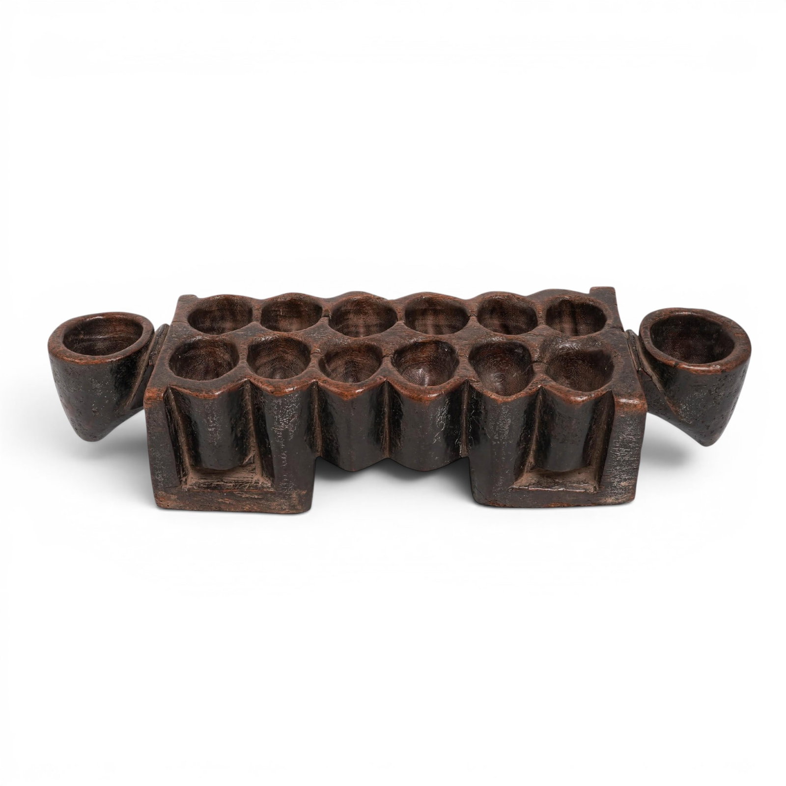 West African Carved Wooden Mancala / Kalaha Board: West African Carved Wooden Mancala / Kalaha Board 20th century, Africa A West African hand-carved wooden Mancala board—frequently known as an Oware, Ayo, or Kalaha board depending on the specific re