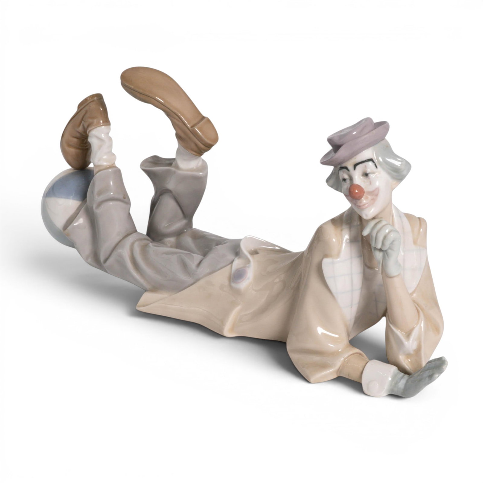 Lladro Porcelain Clown Figurine "Payaso Acostado": Lladro Porcelain Clown Figurine "Payaso Acostado" c. 1970, Spain. The Lladró porcelain large figurine "Payaso Acostado" (Model #4618), also known in English markets as "Clown Lying Down" or "Just a C