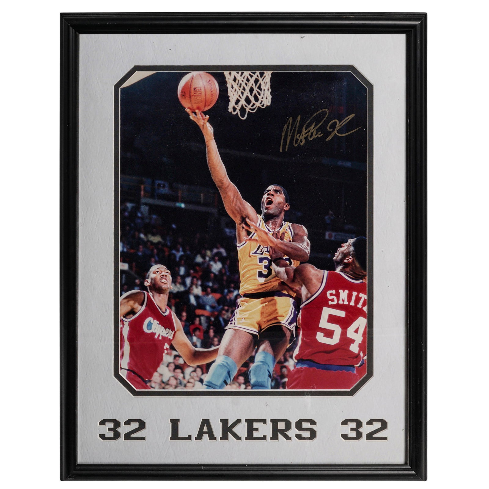 Signed Magic Johnson Los Angeles Lakers Poster: Signed Magic Johnson Los Angeles Lakers Poster 1980s, USA Signed poster depicting Magic Johnson in his iconic No. 32 Los Angeles Lakers jersey dribbling a basketball during game action. The image capt