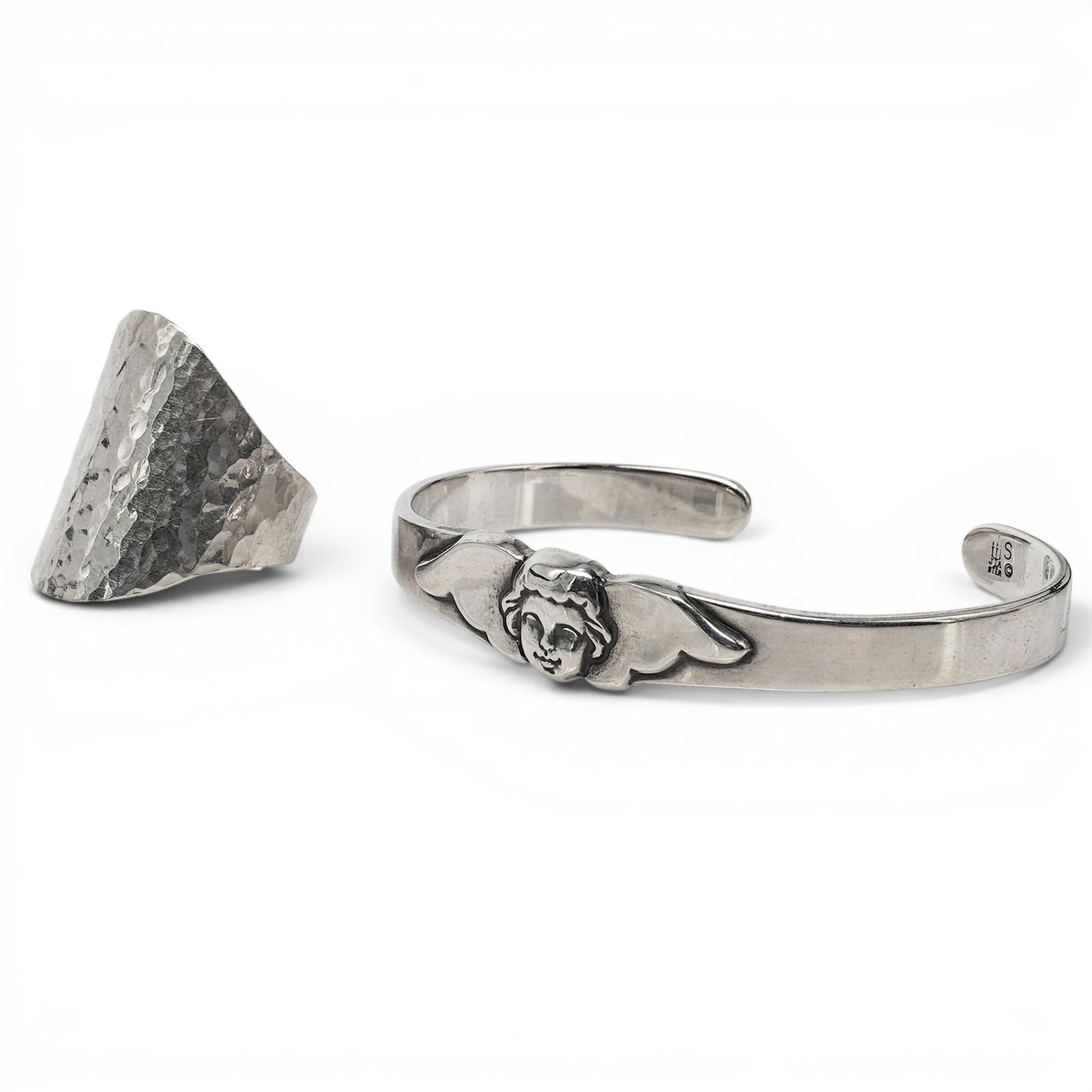 (2 Pcs) James Avery Sterling Silver Ring and Cuff Set: (2 Pcs) James Avery Sterling Silver Ring and Cuff Set 1990s, USA Two-piece James Avery sterling silver set including an open cuff bracelet with applied angel face and wing motif, together with a