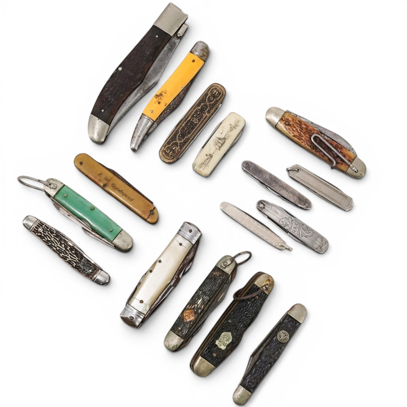 (16 pcs) Collection of Folding Pocket Knives: (16 pcs) Collection of Folding Pocket Knives 20th century Collection of folding hunting knives (1) Faux antler scout's pocket knife. Marked with a shield emblem on body reading "Be Prepared", heavily 