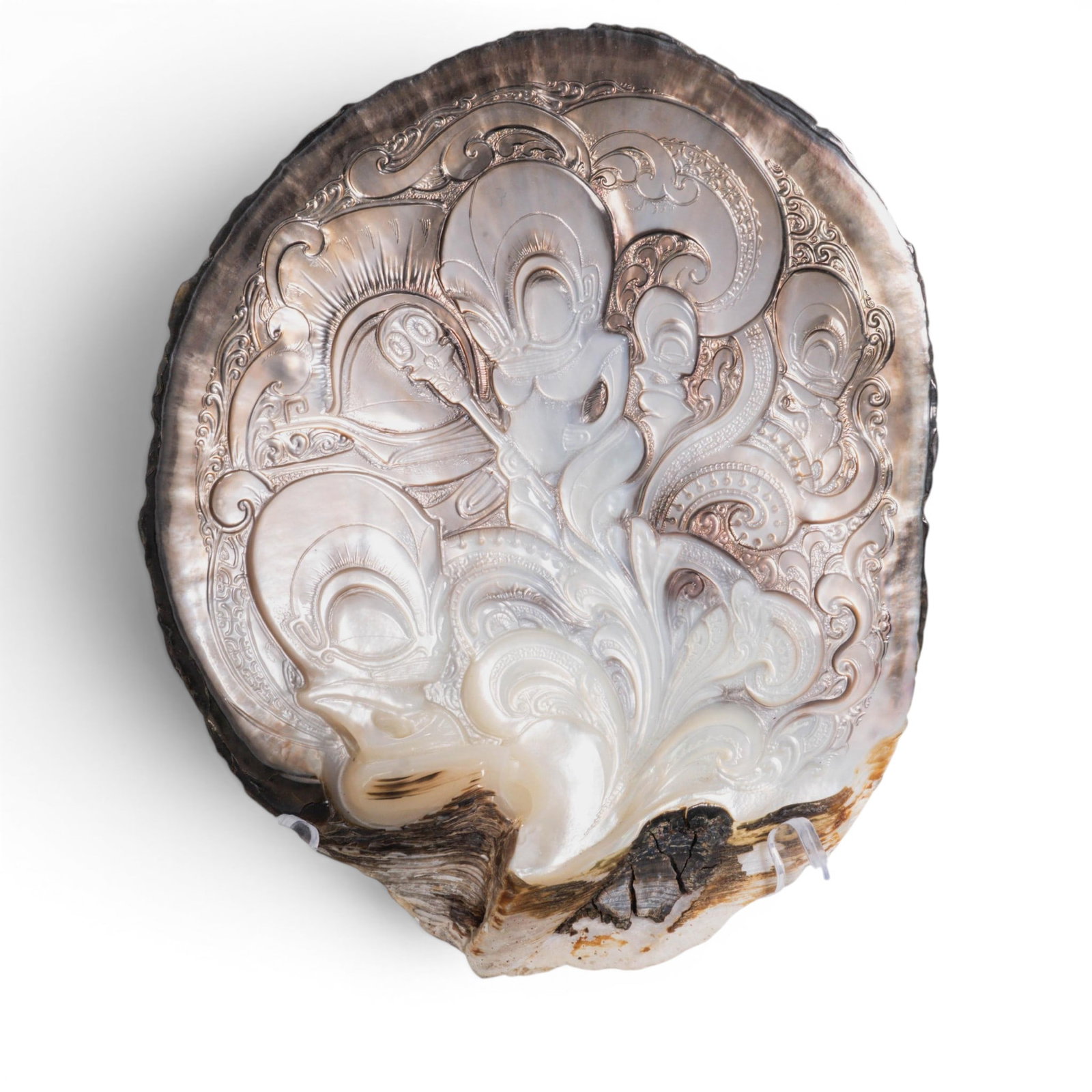 Large Carved Mother of Pearl Oyster Shell w/ Oceanic Motif: Large Carved Mother of Pearl Oyster Shell w/ Oceanic Motif 20th century, French Polynesia, Moorea The piece is crafted from an extra large, polished bivalve shell (such as a black-lip pearl oyster). I