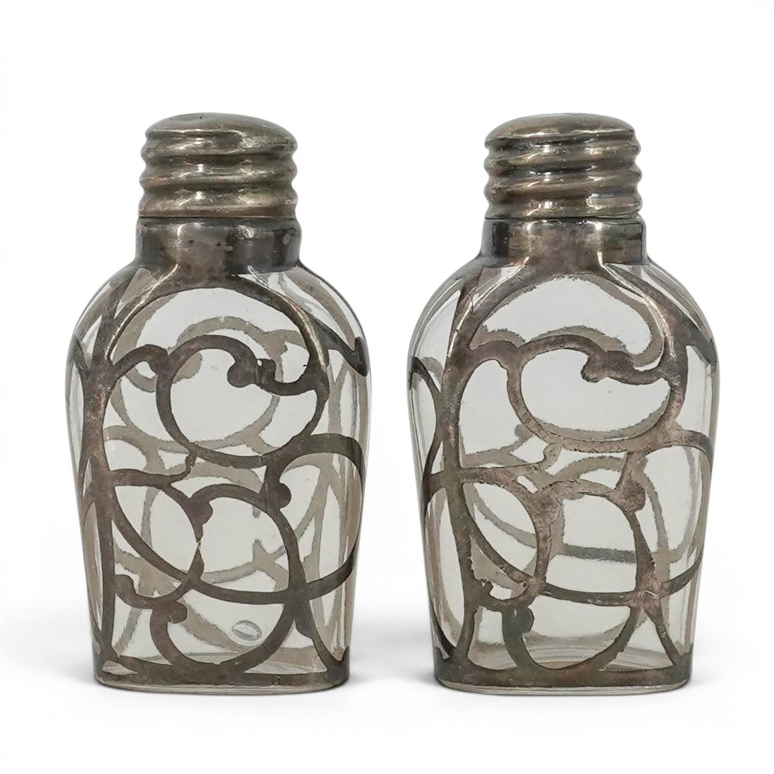 Pair Antique Victorian Sterling Silver Overlay Perfume Bottles: Pair Antique Victorian Sterling Silver Overlay Perfume Bottles c. 1890-1915, USA Pair sterling Silver overlay perfume bottles, monogrammed P.E.K. Each item consists of a small , clear glass bottle com