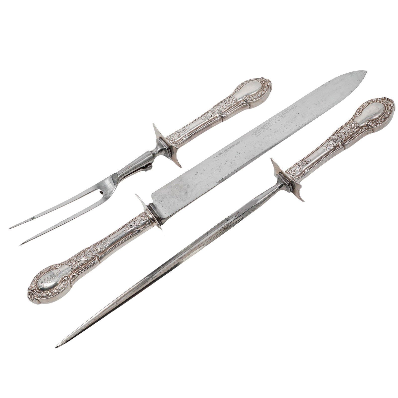 (3pc) Art Nouveau Sterling Silver & Stainless Steel Carving Set: (3pc) Art Nouveau Sterling Silver & Stainless Steel Carving Set Late 19th to early 20th Cent. This antique three-piece tableside carving set features heavily ornamented sterling silver handles
