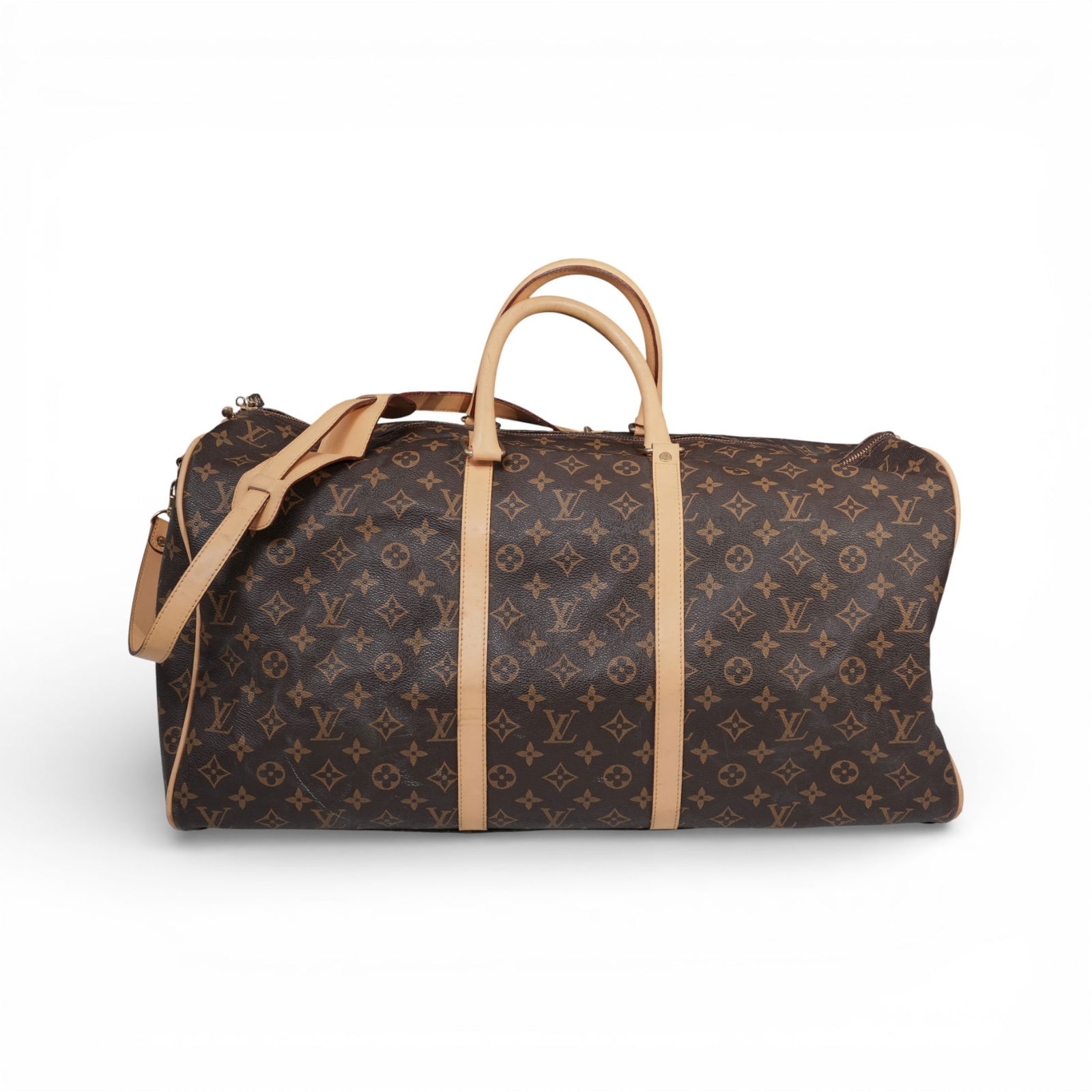 Louis Vuitton Small Duffel Bag: Louis Vuitton Small Duffel BagMid to late 20th century, ItalianA Louis Vuitton small duffel bag. Leather construction with LV monogram pattern and light brown leather trim and accents. Includes a stra