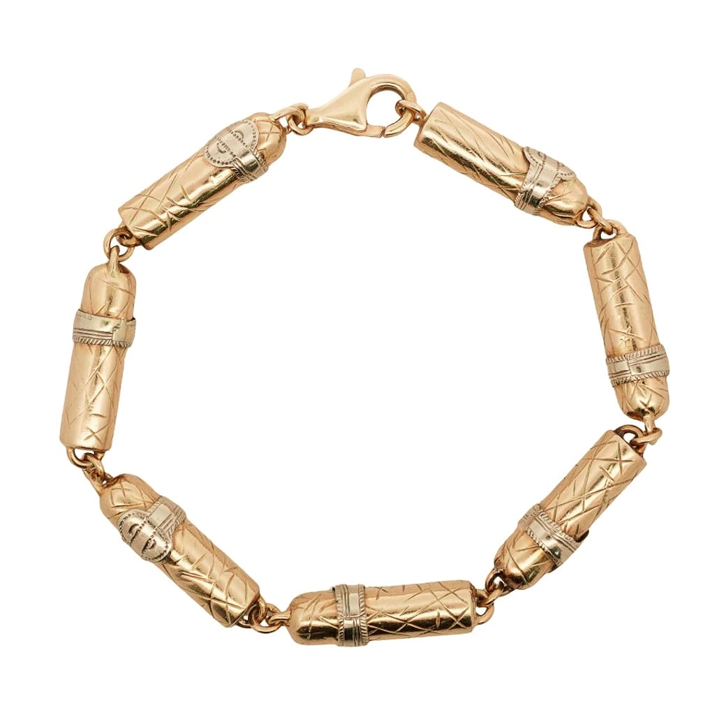 French 18k Gold Cigar Bracelet: French 18k Gold Cigar BraceletFranceFrench 18k yellow gold cigar formed chain-link bracelet, with lobster safety clasp. Marked: Eagle export and makers mark. Total Weight: 16.7 Dwt.L: 7.5"