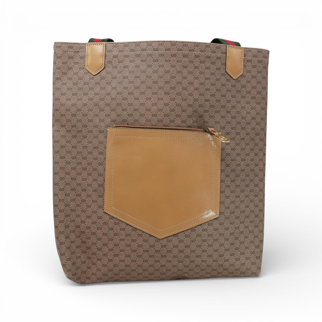 Vintage Gucci GG Supreme Canvas Tote Bag: Vintage Gucci GG Supreme Canvas Tote Bagcirca 1970s-1980s, ItalianThe tote features the signature beige/brown GG Supreme canvas (a coated canvas material), with contrasting tan leather trim and an ext