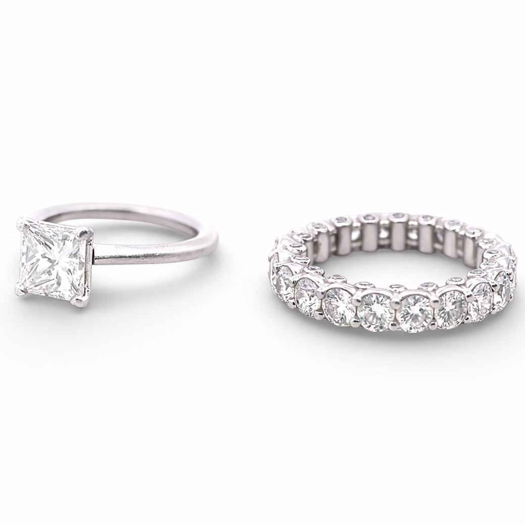 Platinum Diamond Engagement Ring & Eternity Band Set: Platinum Diamond Engagement Ring & Eternity Band SetCirca Late 20th CenturyPlatinum diamond ring set consisting of a solitaire engagement ring and a matching eternity band, sold together as a set. The