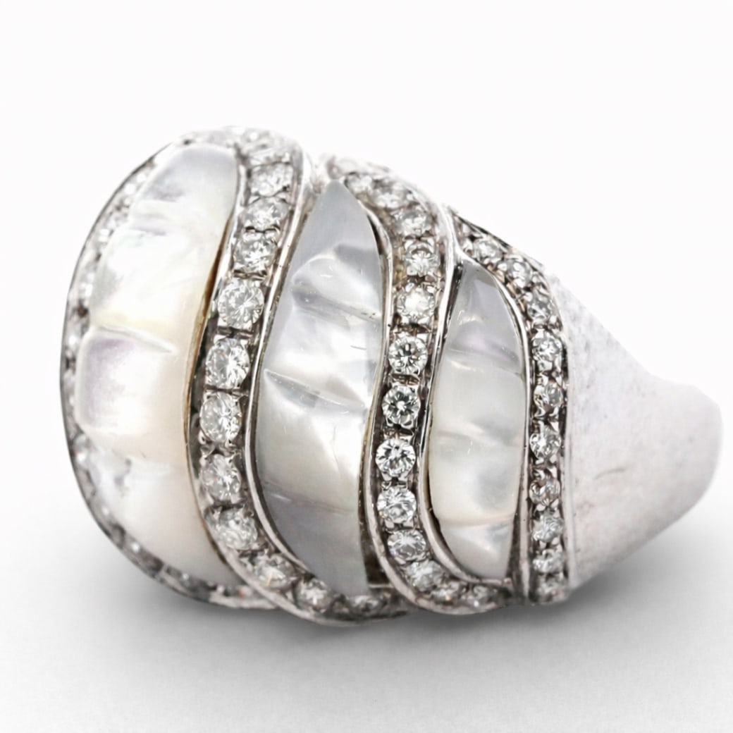 Vintage Italian 18k Gold Diamond & MOP Dome Ring Signed: Vintage Italian 18k Gold Diamond & MOP Dome Ring SignedCirca: 1990s-2000s, Italy.Vintage 18K white gold dome ring featuring carved mother-of-pearl panels arranged in a tiered, fluted pattern. The carv
