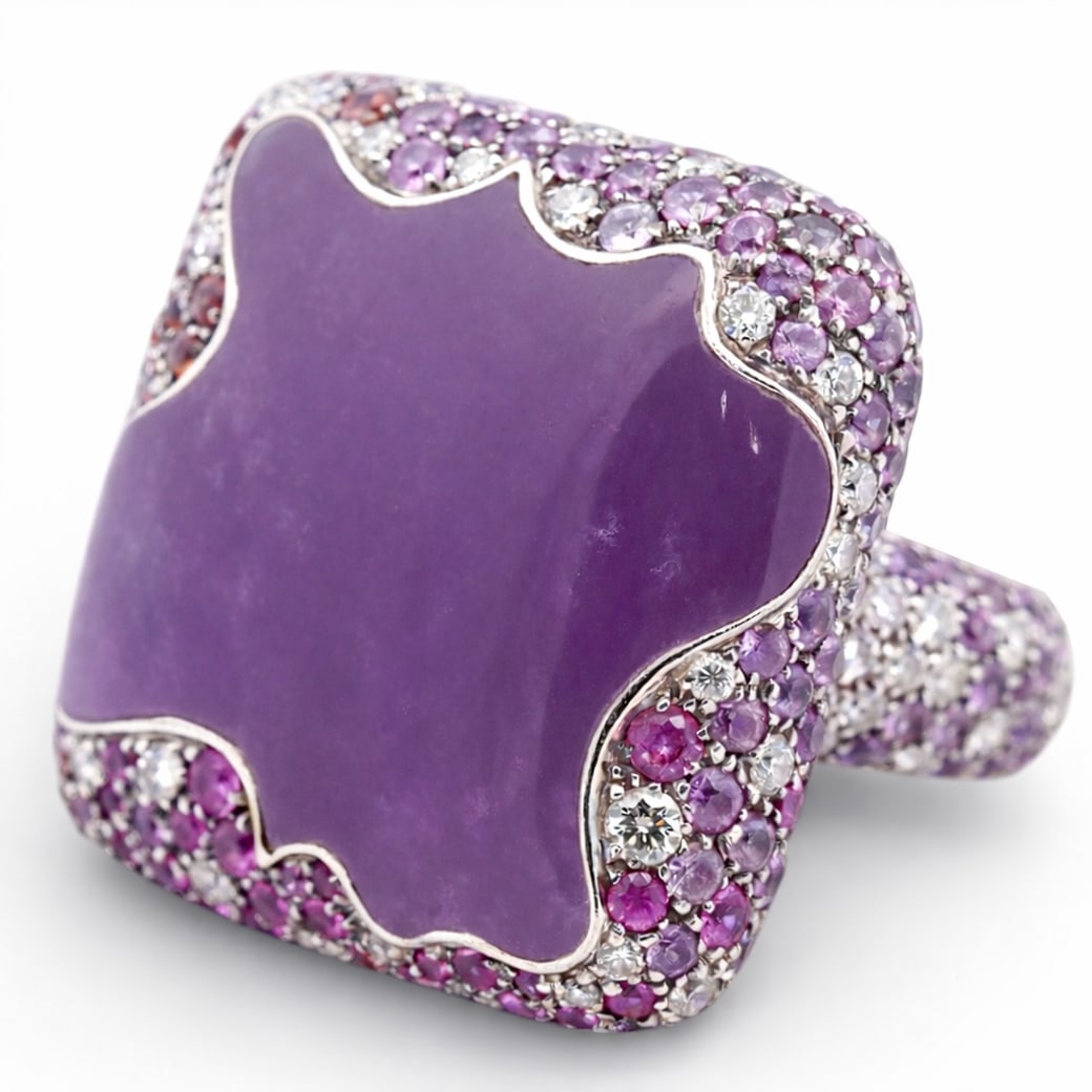 Valente 18k Gold Amethyst Diamond & Sapphire Cocktail Ring: Valente 18k Gold Amethyst Diamond & Sapphire Cocktail RingCirca 1990s-2000s, Italian18k white gold cocktail ring by Valente, centered by a sculptural freeform cabochon amethyst measuring approximately