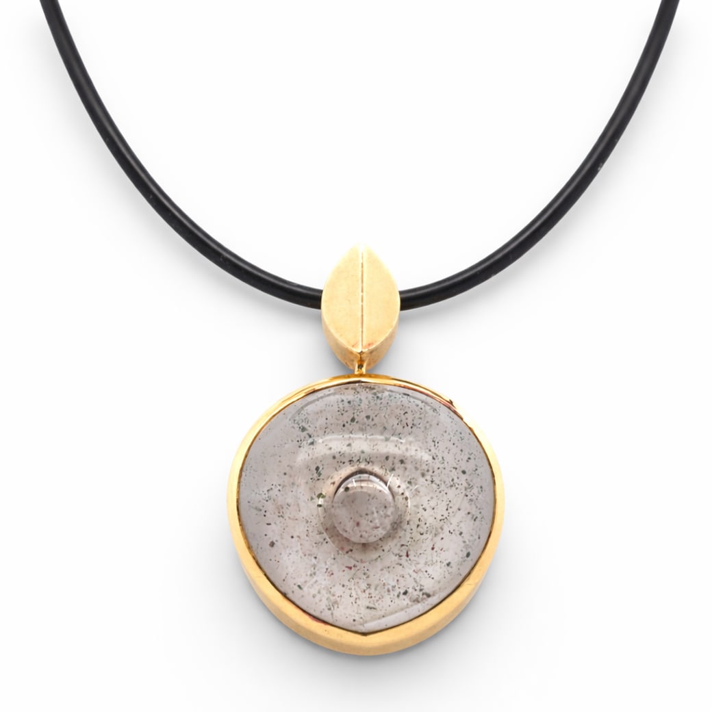 18k Gold & Glass Pendant Necklace Signed: 18k Gold & Glass Pendant Necklace SignedCirca late 20th Century, European18k yellow gold pendant featuring a circular studio glass cabochon with suspended metallic inclusions. The glass element is rev