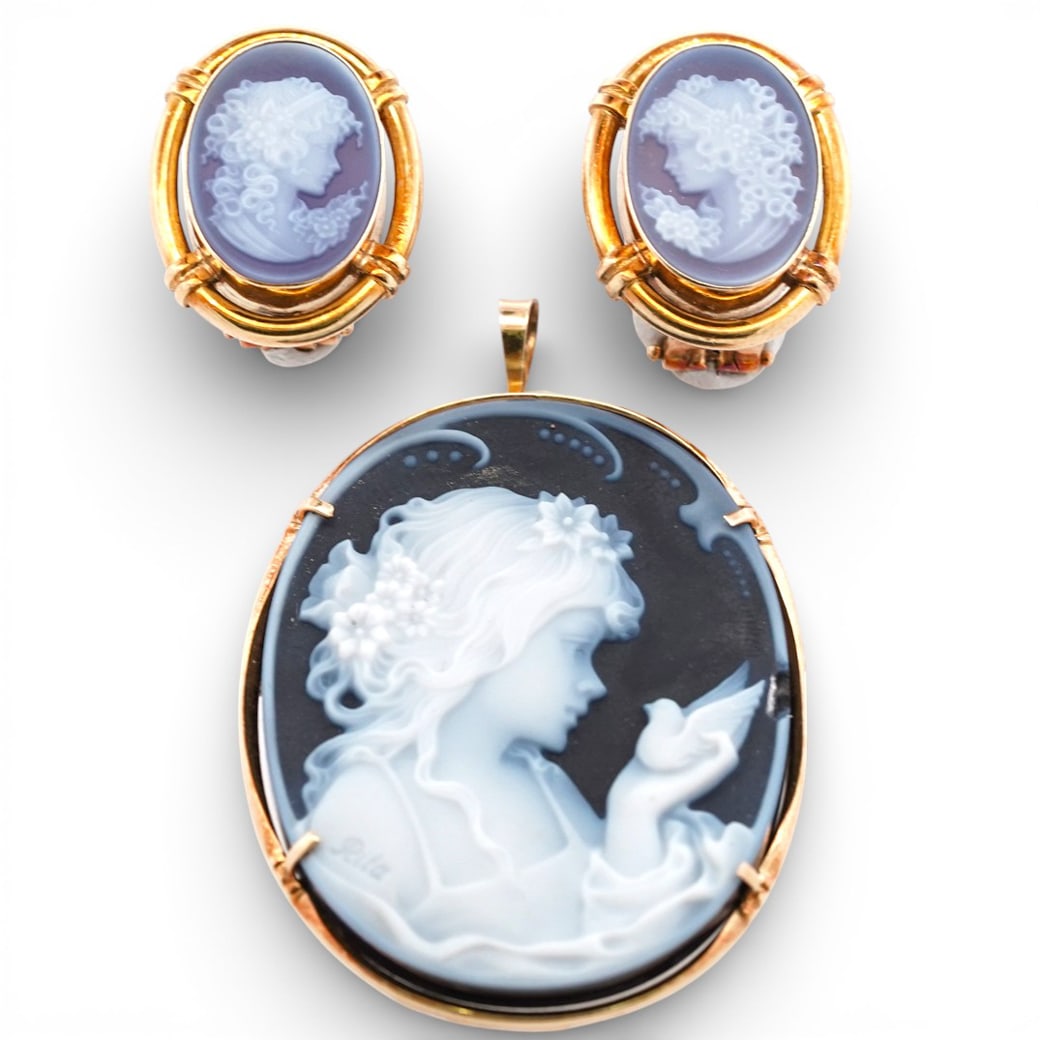 (3 Pcs) Italian 18k Gold & Carved Shell Cameo Suite Signed: (3 Pcs) Italian 18k Gold & Carved Shell Cameo Suite Signed 20th century, Italian The suite comprises a brooch/pendant and a pair of matching earrings, all set with oval carved shell cameos depicting
