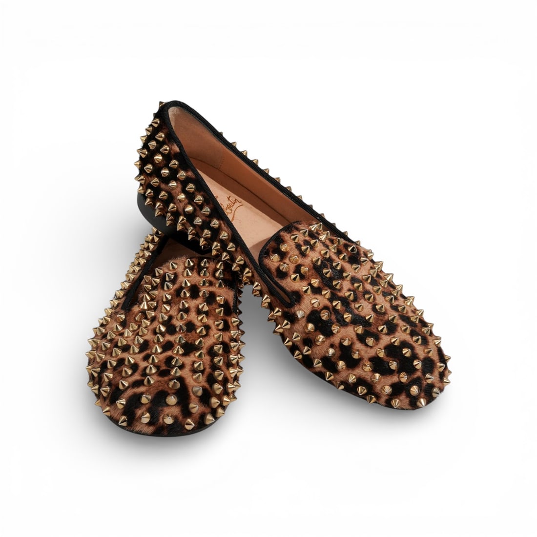 Christian Louboutin Womens "Rolling Spikes Flat" Shoes: Christian Louboutin Womens "Rolling Spikes Flat" Shoes2011, FrenchA pair of Christian Louboutin women's rolling spikes flat shoes featuring a striking multicolor leopard pattern pony hair upper with m
