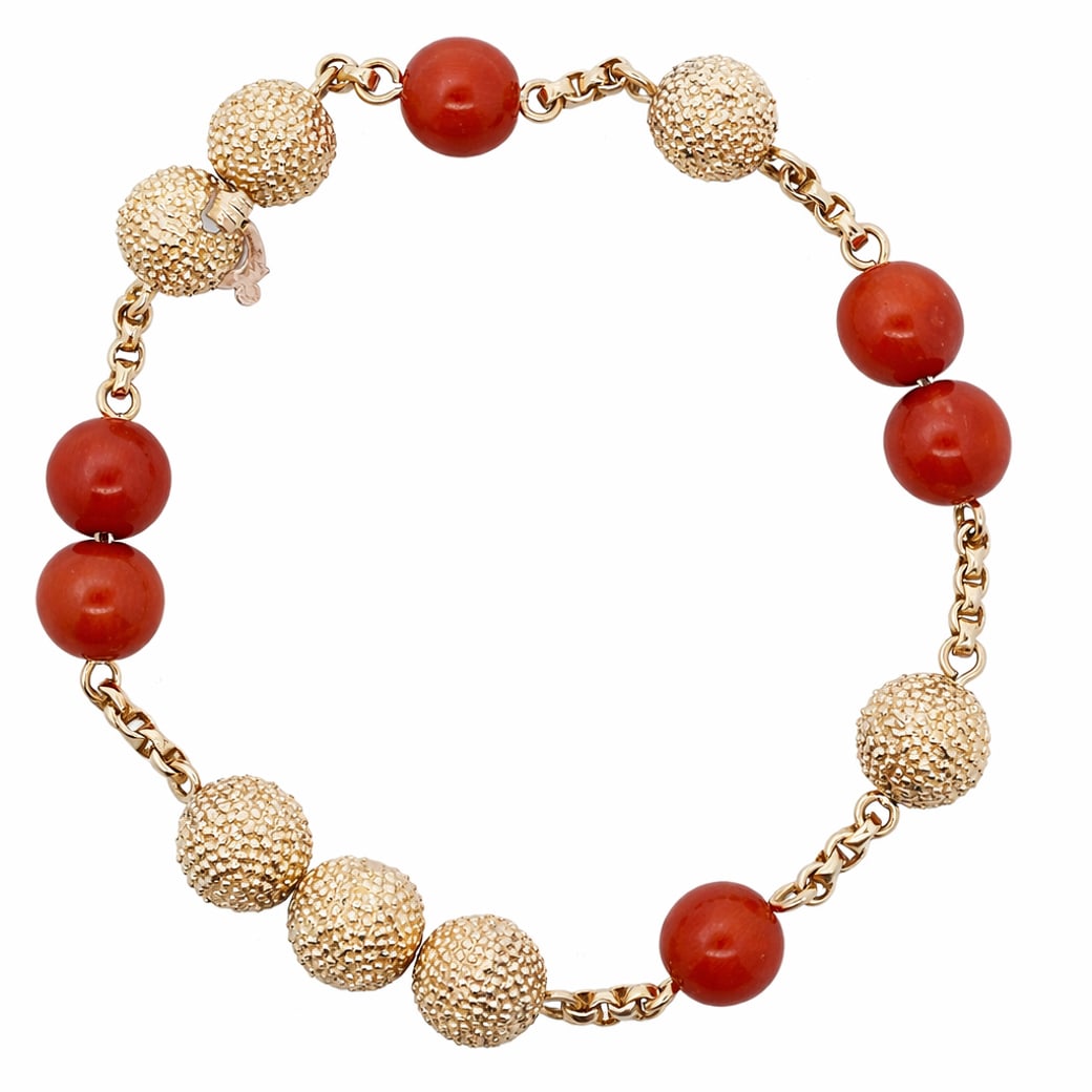 Van Cleef & Arpels 18k Gold & Coral Bead Bracelet: Van Cleef & Arpels 18k Gold & Coral Bead BraceletCirca: 1970s-1980s, France.Vintage 18k yellow gold Van Cleef & Arpels bracelet composed of alternating textured gold boules and polished coral beads, l