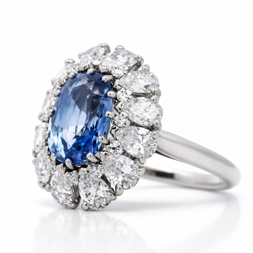 Platinum GIA Certified No Heat Sri Lankan Sapphire & Diamond Ring: Platinum GIA Certified No Heat Sri Lankan Sapphire & Diamond RingCirca: 1990s-2000s, Sri Lanka.Platinum ring centering a GIA-certified natural sapphire from Sri Lanka, oval modified brilliant cut, mea