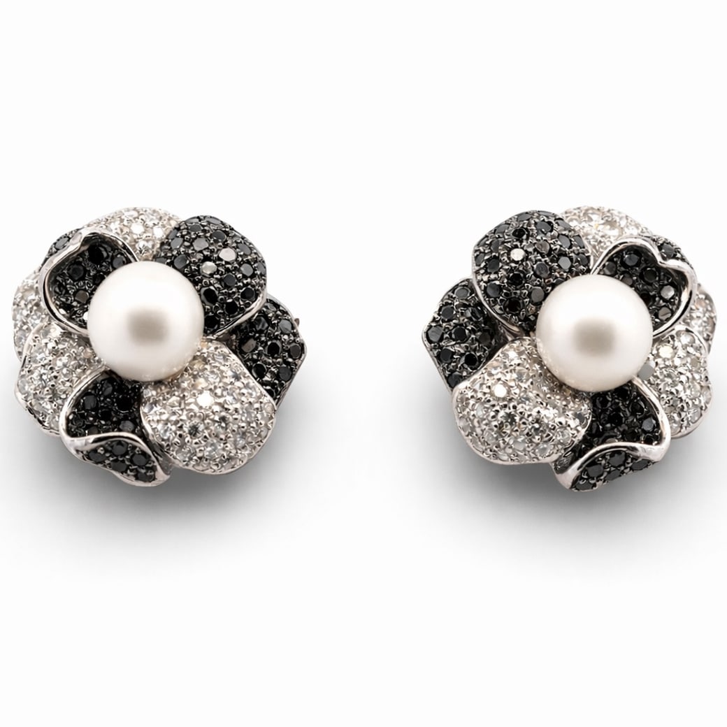 18k Gold Diamond & Pearl Earrings: 18k Gold Diamond & Pearl EarringsCirca 1990s-2000s18k white gold flower-form earrings, each centered by a round cultured pearl measuring approximately 10.0 mm in diameter. The petals are pavé-set wit
