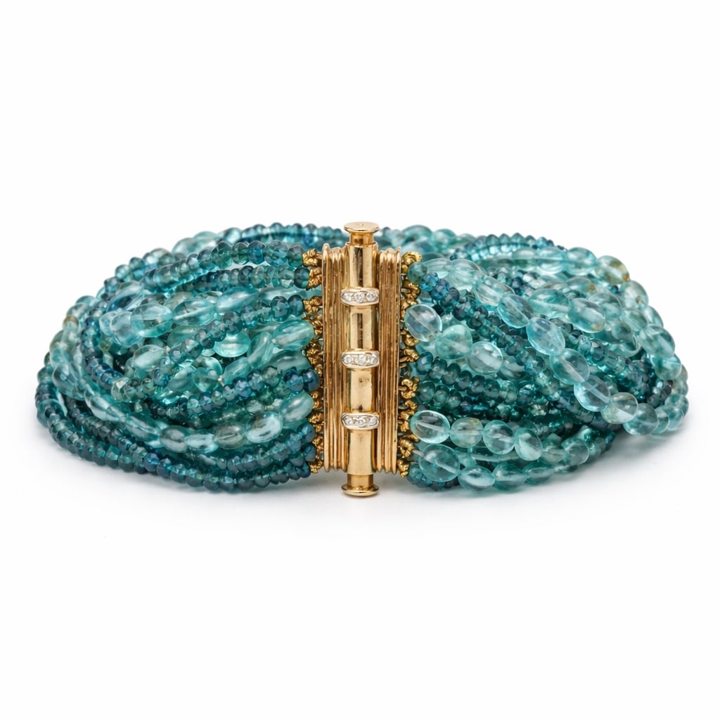 Verdura 18k Gold Apatite & Diamond Multi-Strand Bracelet: Verdura 18k Gold Apatite & Diamond Multi-Strand BraceletCirca: Early 21st Century, Italy.Verdura multi-strand bracelet composed of faceted blue apatite beads arranged in dense graduated strands, secur