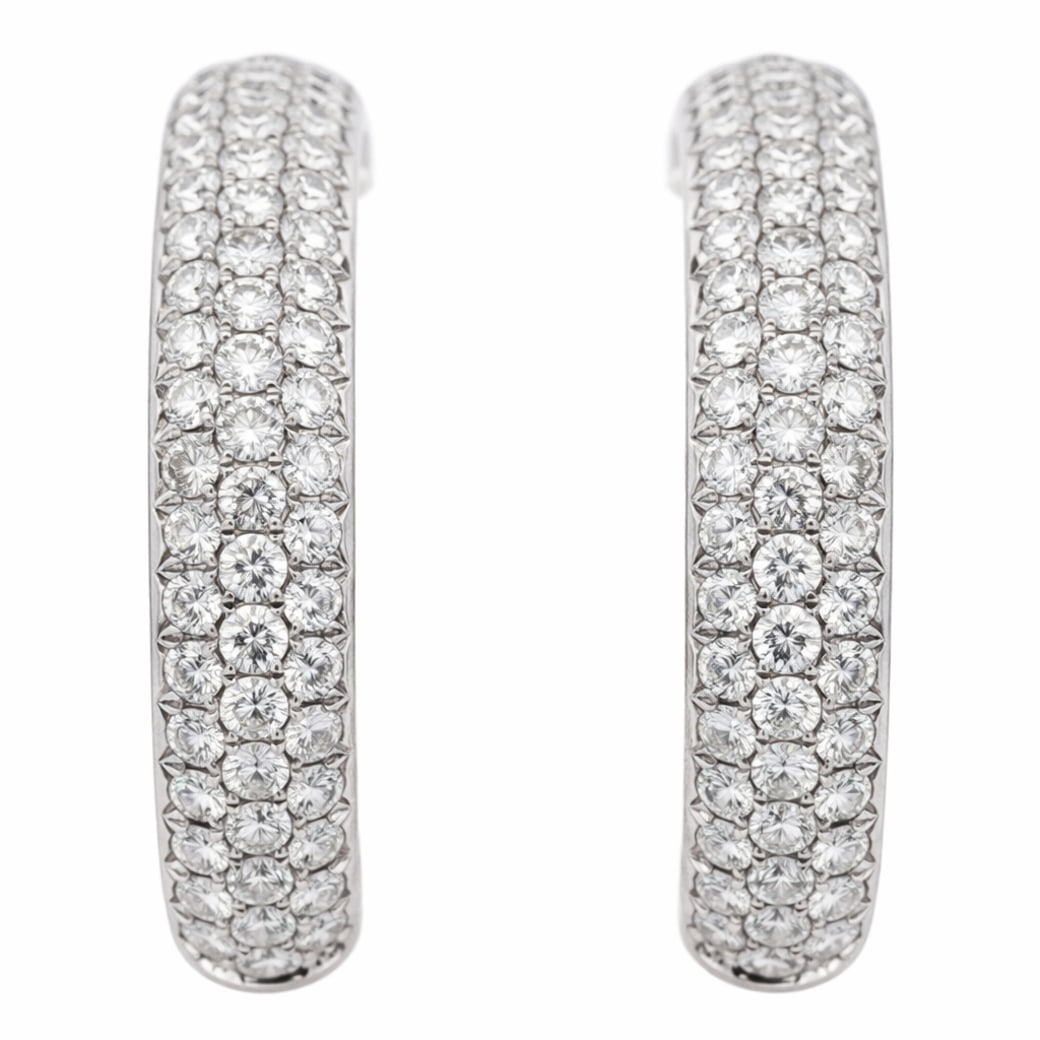 Clelia 18K Gold & Diamond Hoop Earrings: Clelia 18K Gold & Diamond Hoop EarringsCirca 2000s, BritishClelia hinged hoop earrings crafted in 18 karat white gold, designed with a three-row pavé diamond front set with approximately 4.04 carats