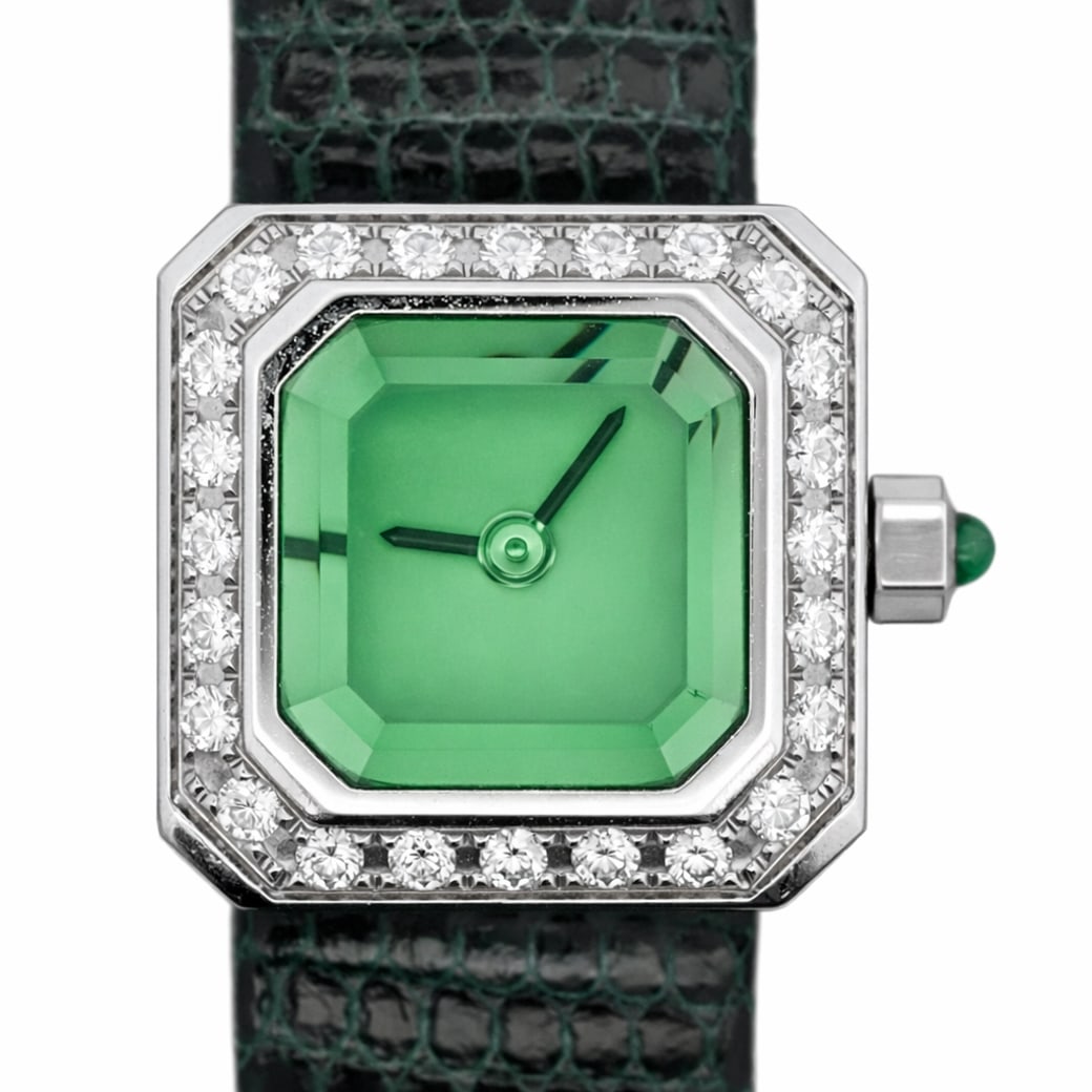 Corum "Sugar Cube" Diamond & Green Sapphire Ladies Watch REF#137.422.47: Corum "Sugar Cube" Diamond & Green Sapphire Ladies Watch REF#137.422.47Circa 1990s, 2000s, SwissLadies Corum "Sugar Cube" wristwatch, reference 137.422.47, featuring an octagonal white metal case fram