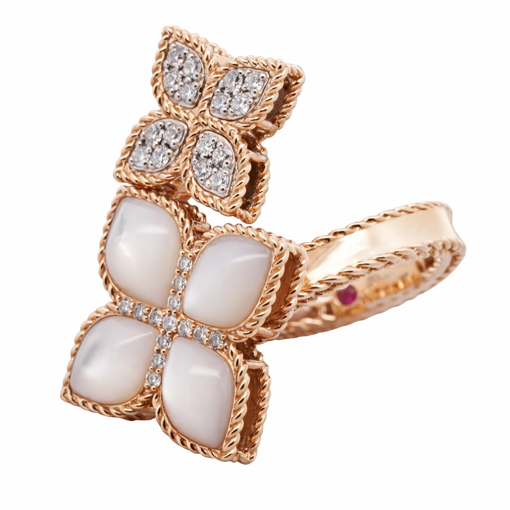 Roberto Coin 18k Gold MOP & Diamond Flower Ring: Roberto Coin 18k Gold MOP & Diamond Flower RingCirca: 2000s, Italy.18k gold floral ring by Roberto Coin, featuring a larger four-petal motif set with mother-of-pearl doublets and a smaller pavé-set d