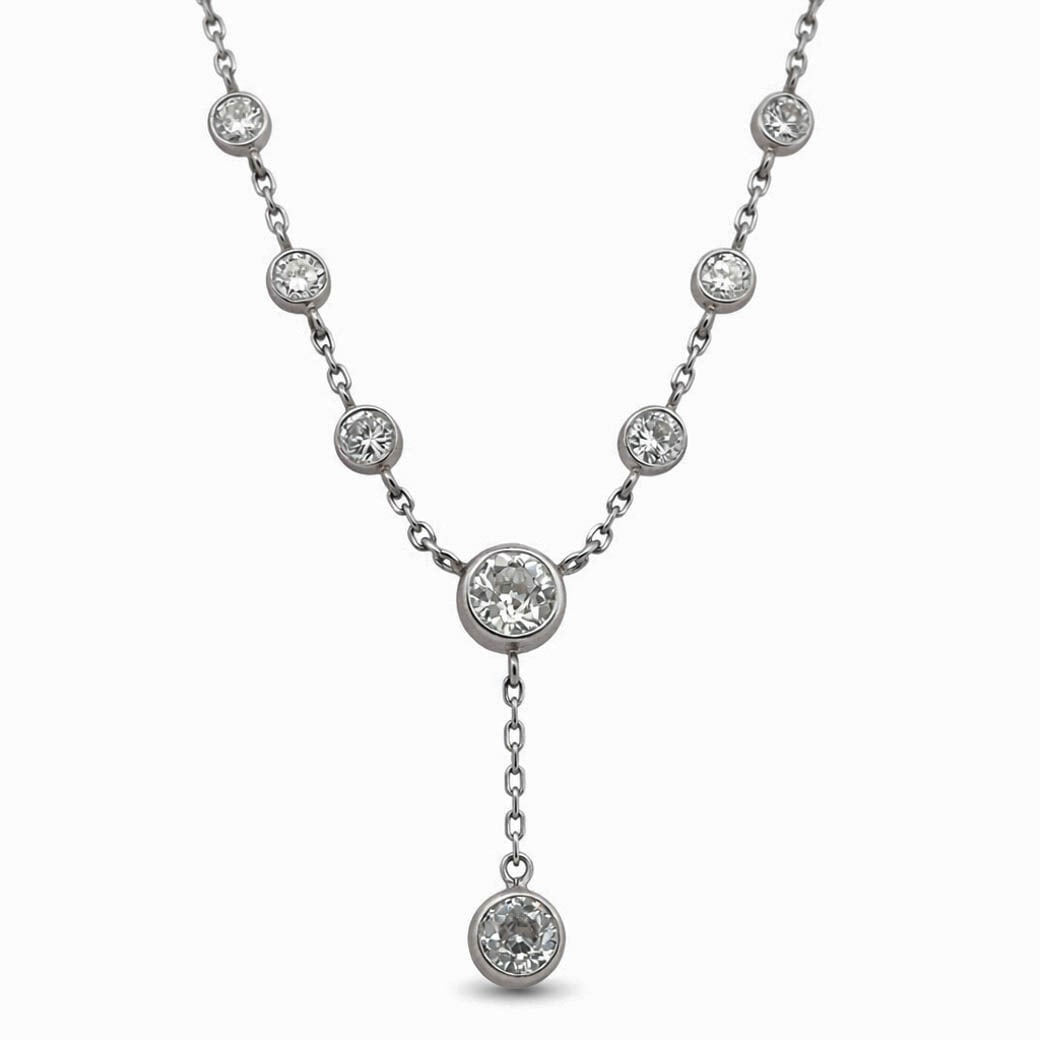 Raymond Yard Art Deco Platinum Diamond Necklace: Raymond Yard Art Deco Platinum Diamond Necklace1925-1935, FrenchArt Deco platinum station necklace by Raymond Yard, bezel-set with graduated round diamonds along articulated platinum links and centere