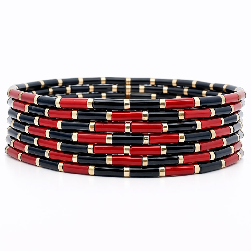 Angela Cummings for Tiffany & Co. 18k Gold Necklace: Angela Cummings for Tiffany & Co. 18k Gold NecklaceCirca 1970s-1980s, USATiffany & Co. multi-strand bead necklace comprised of cylindrical coral and black onyx bead accent segments, articulated with r