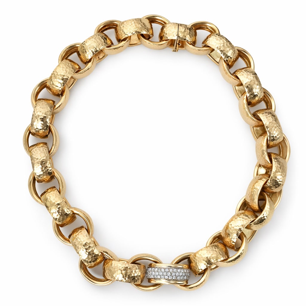 18k Gold & Diamond Hammered Necklace: 18k Gold & Diamond Hammered NecklaceCirca 1980s-1990sSubstantial 18k yellow gold textured link chain necklace featuring a single pavé diamond accent link. The necklace is composed of alternating poli