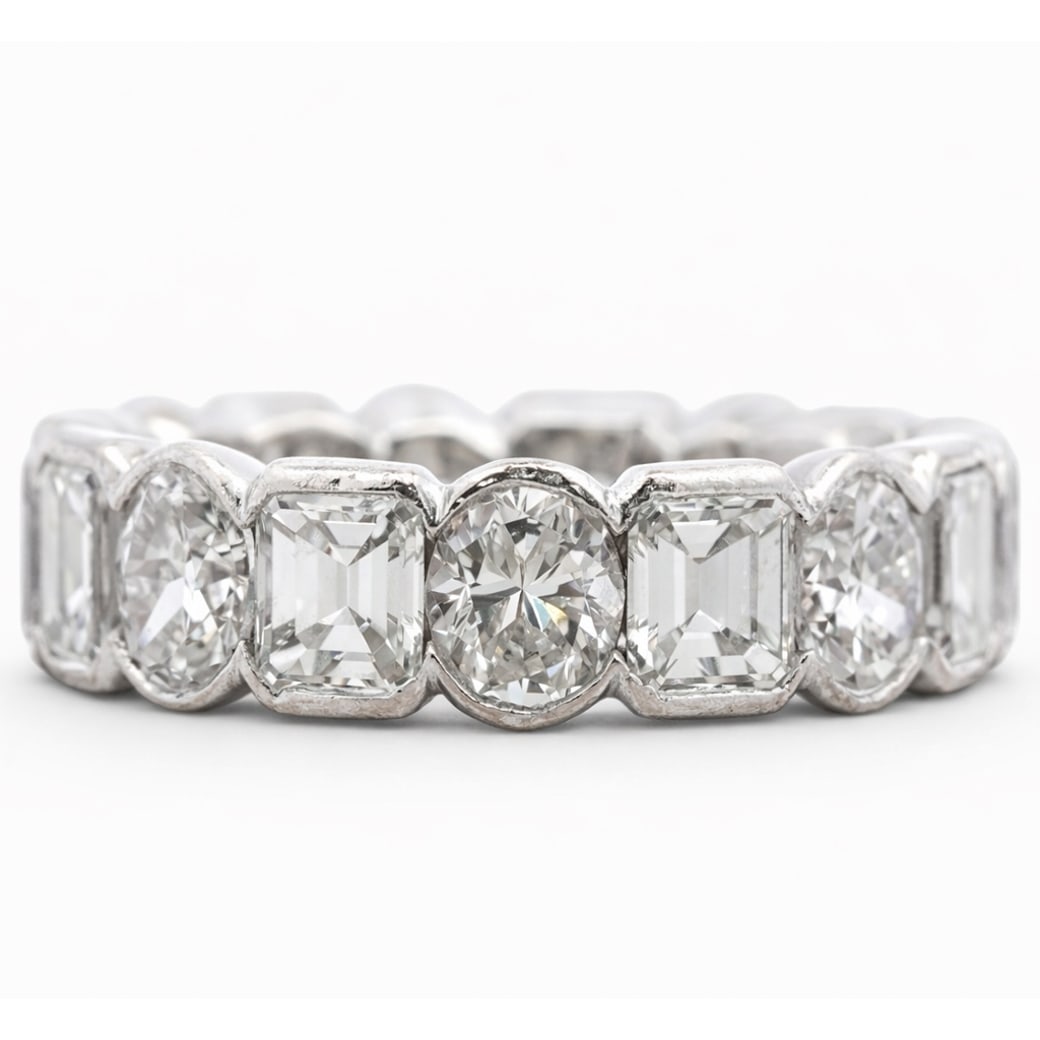 Graff Platinum Oval & Asscher Cut Diamond Eternity Ring: Graff Platinum Oval & Asscher Cut Diamond Eternity RingCirca: 2002, USA.A superb platinum diamond eternity band by Graff, set with alternating oval brilliant-cut and Asscher-cut diamonds of exceptiona