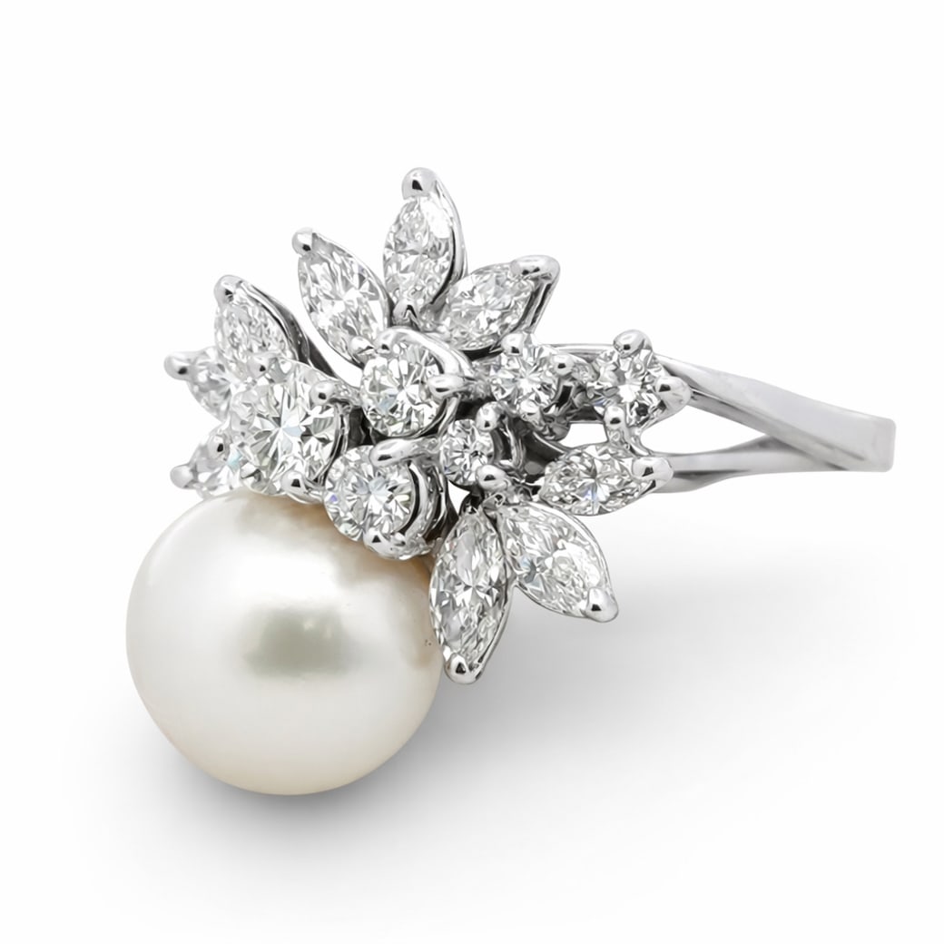 Vintage 18k Gold Pearl & Diamond Cluster Ring Signed: Vintage 18k Gold Pearl & Diamond Cluster Ring SignedCirca 1960s-1970s18 karat white gold ring designed with a floral cluster of marquise and round-cut diamonds weighing approximately 1.05 carats total