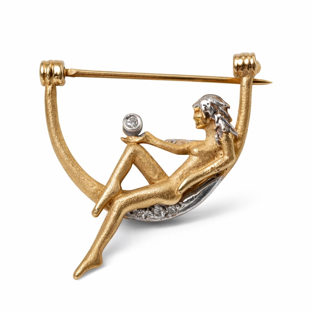 14k Gold & Diamond Figural Brooch: 14k Gold & Diamond Figural BroochCirca 1940s, USAFigural brooch depicting a stylized reclining woman seated on a crescent-shaped swing, rendered in sculptural yellow gold with textured surfaces and ar