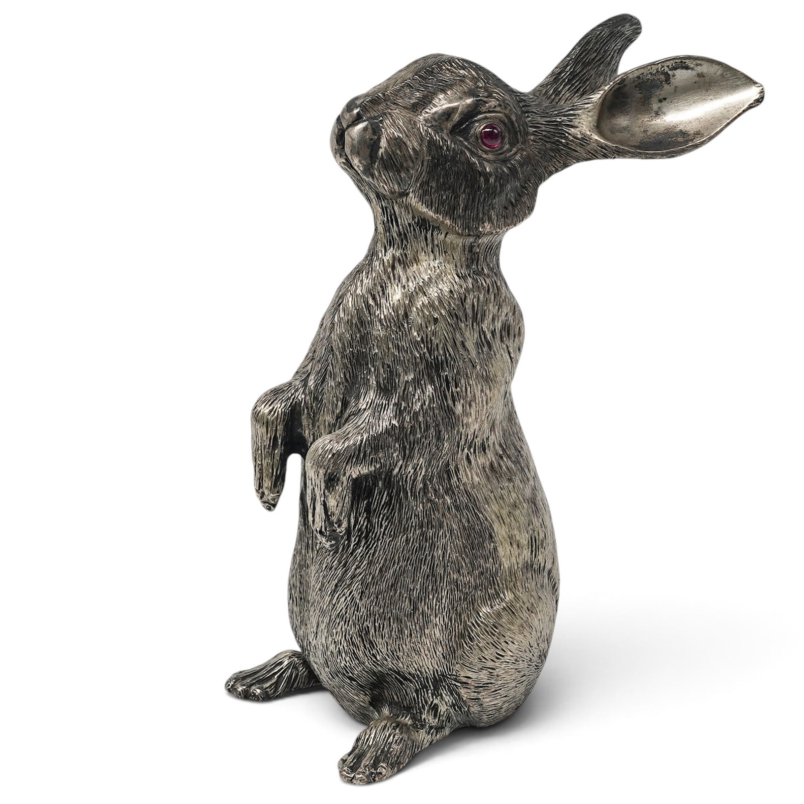 Russian Faberge-Style Silver and Ruby Eye Rabbit Figure: Russian Faberge-Style Silver and Ruby Eye Rabbit Figure 20th Cent., Russian Russian Faberge-style 88 silver rabbit figure, featuring a finely modeled standing rabbit form with textured fur detailing a