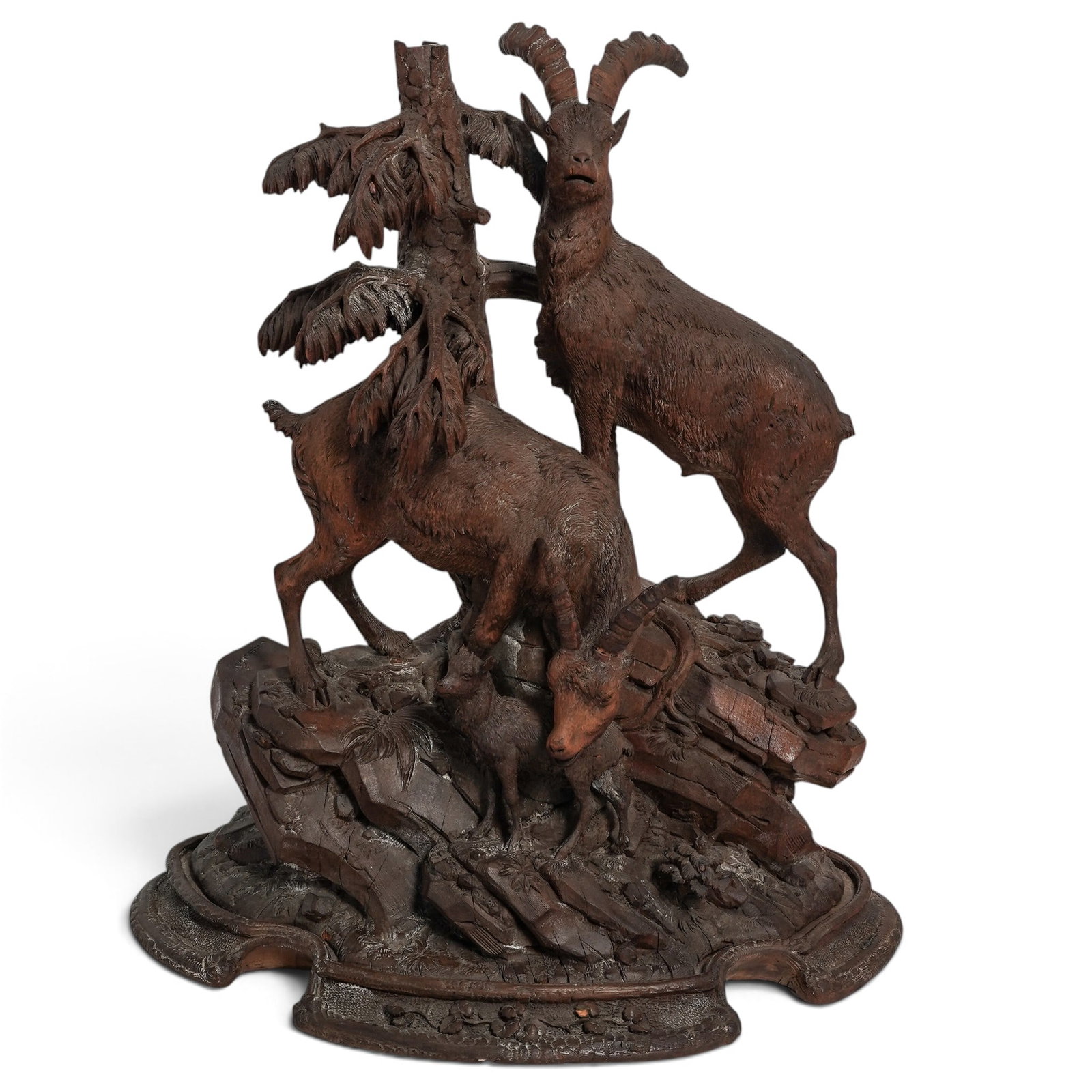 Johann Grossmann Black Forest Carved Wood Goat Sculpture: Johann Grossmann Black Forest Carved Wood Goat Sculpture Mid-19th Century, Switzerland Exceptional hand-carved Black Forest wood sculpture depicting an alpine ibex family with two mature goats and a k