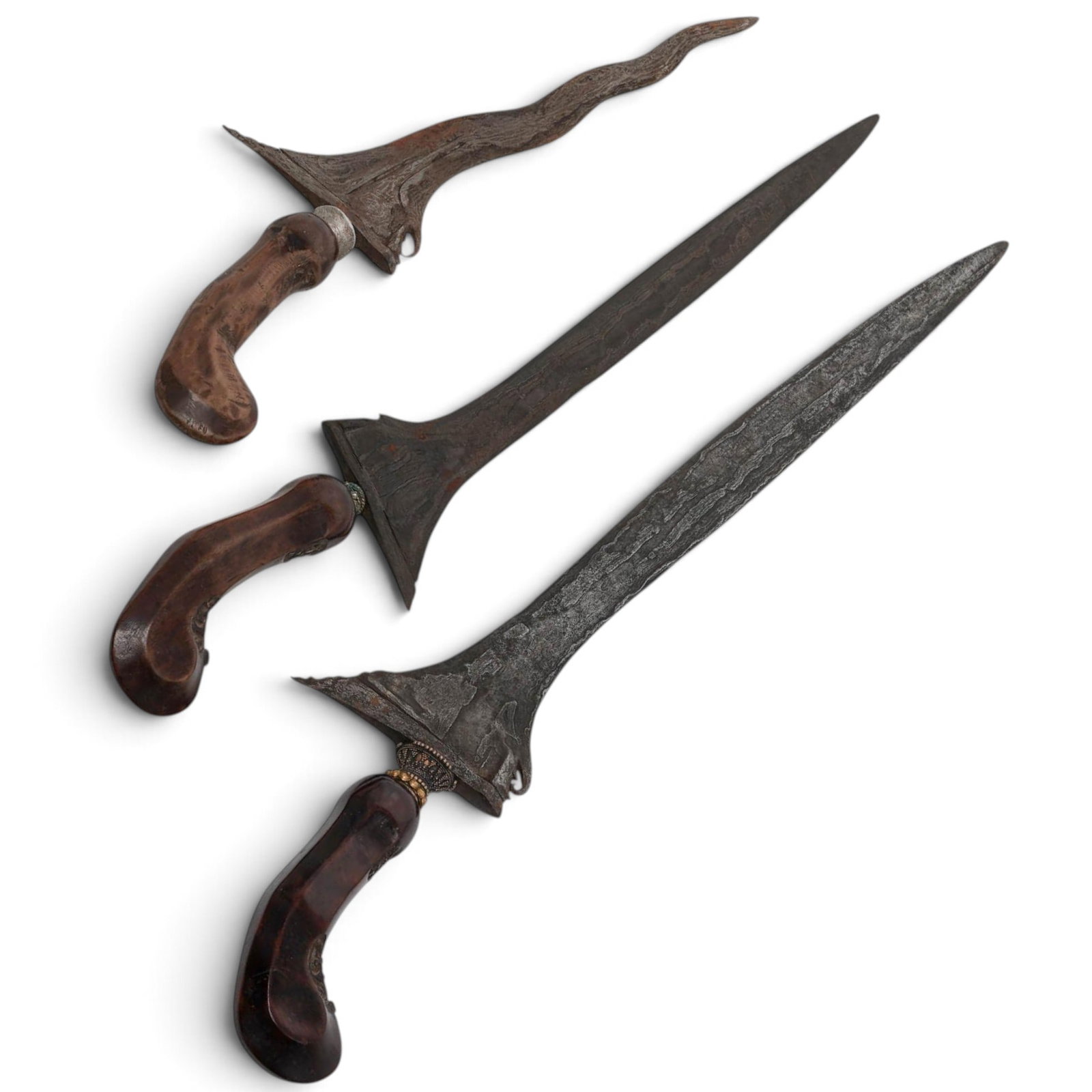 (3 pcs) Indonesian Javanese Kris (Keris) Daggers: (3 pcs) Indonesian Javanese Kris (Keris) Daggers Late 18th-19th century, Indonesian A set of three Indonesian Javanese Kris (Keris) daggers. See below. (1) Javanese Kris (Keris) Luk Dagger with Ornate