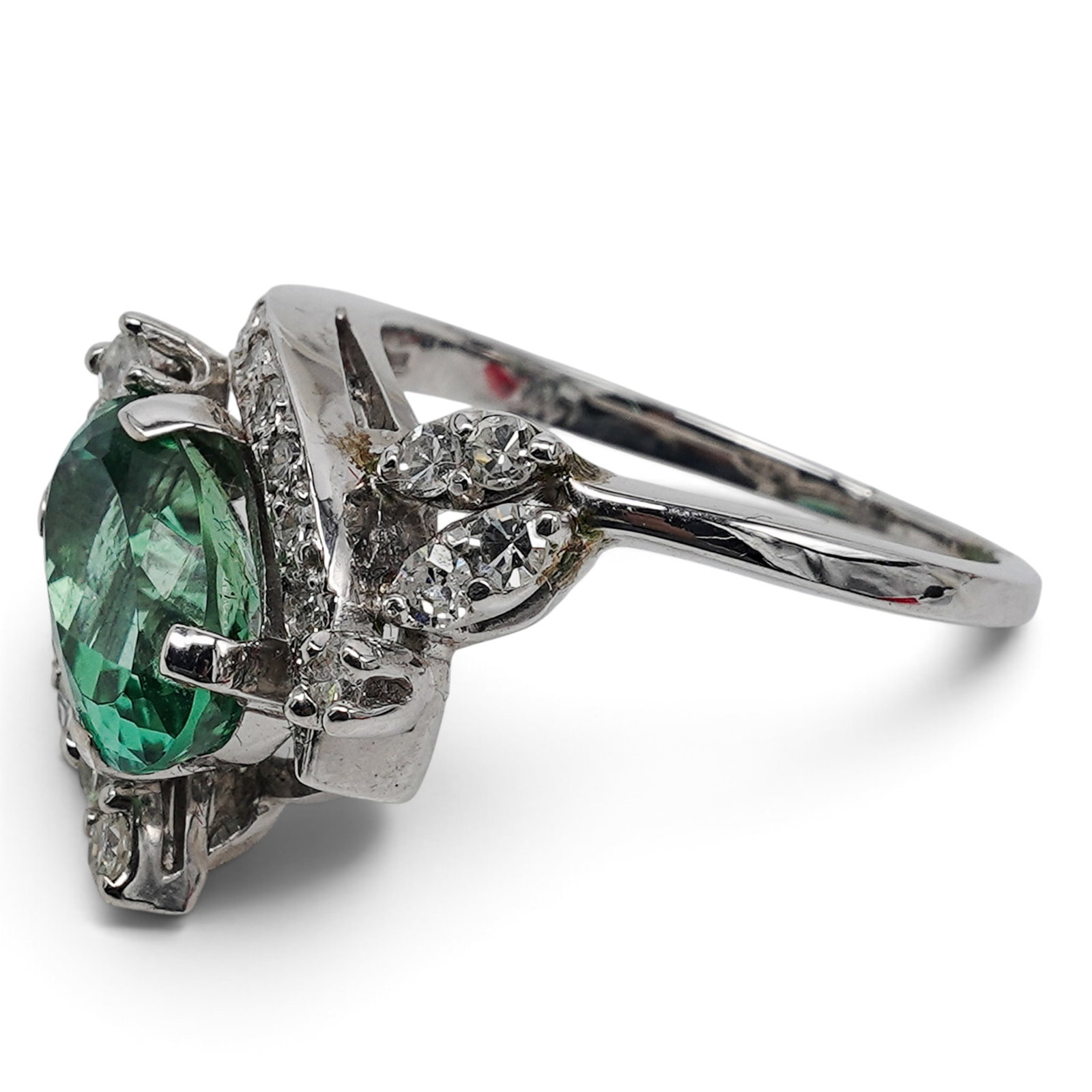 18k White Gold Aquamarine & Diamond Cocktail Ring: 18k White Gold Aquamarine & Diamond Cocktail Ring 20th Cent. Centering an approximately 11 x 7 x 6mm oval faceted Green aquamarine weighing approximately 2.5 carats, accented by approximately 1.10 car