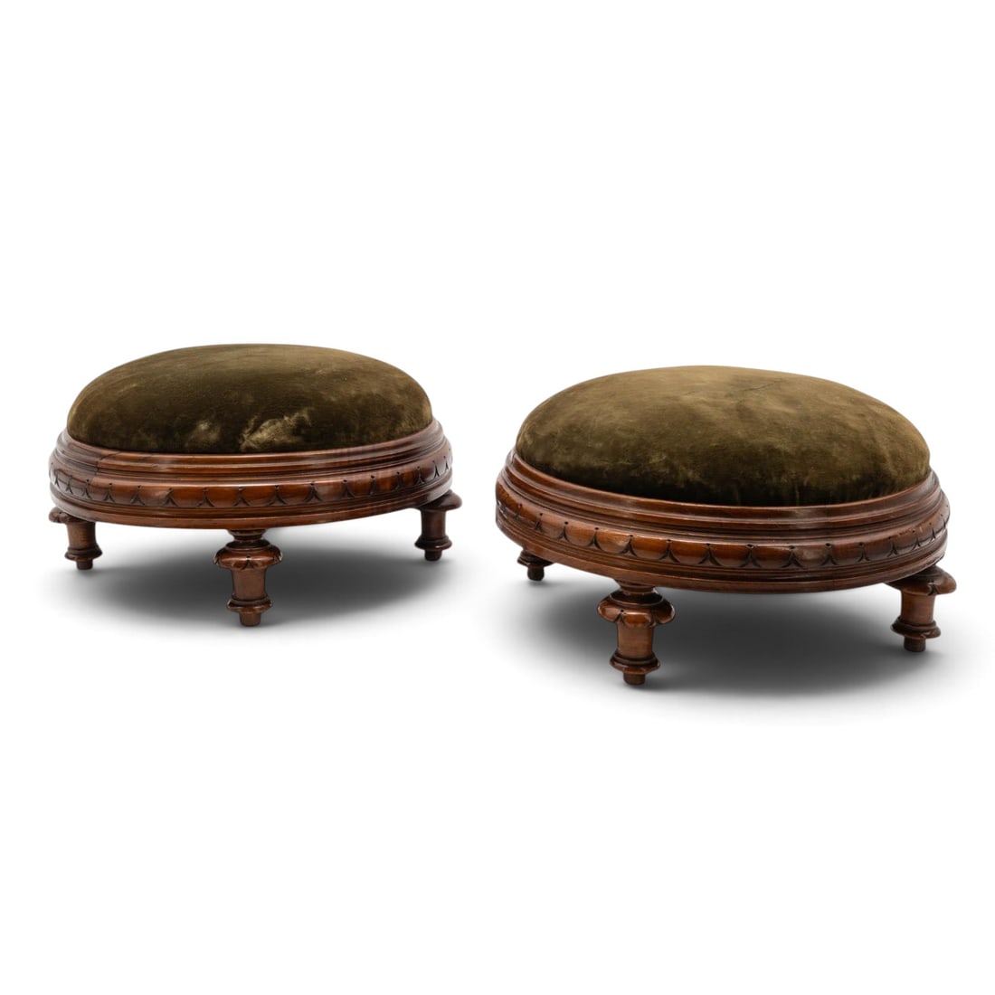Pair of Victorian Velvet & Carved Wood Footstools: Pair of Victorian Velvet & Carved Wood Footstools Late 19th Century, England A pair of Victorian carved wood footstools, each featuring a circular upholstered green velvet cushion over a turned and mo