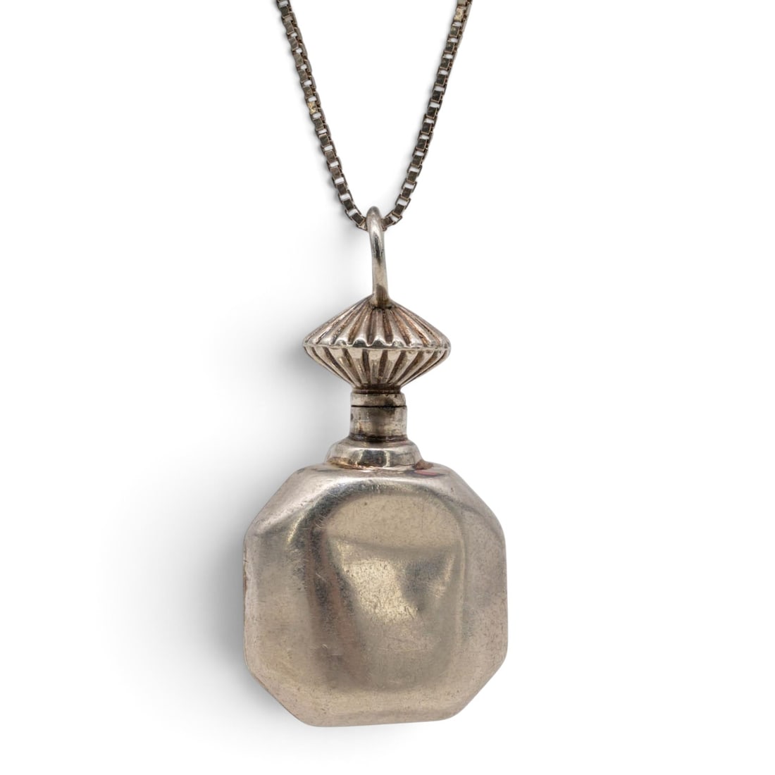 Vintage Sterling Silver Perfume Bottle Pendant Necklace: Vintage Sterling Silver Perfume Bottle Pendant Necklace Mid-to-Late 20th Century Vintage perfume bottle-form pendant with rounded rectangular body, narrow neck, and decorative applicator wand Stamped 