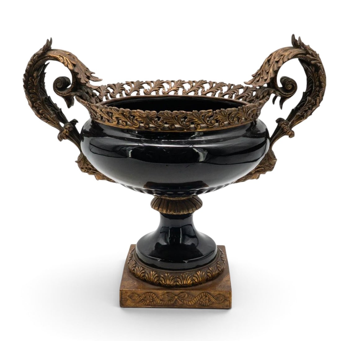 French Empire Style Black Porcelain & Bronze Urn: French Empire Style Black Porcelain & Bronze Urn Mid-20th Century, France French Empire-style decorative urn featuring a glossy black porcelain body mounted with ornate gilt bronze decoration. The bow