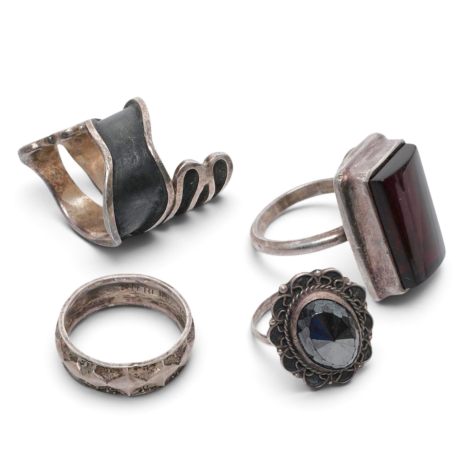 (4 Pcs) Sterling Silver & Gemstone Ring Group: (4 Pcs) Sterling Silver & Gemstone Ring Group Late 20th century, Mixed Origin Four-piece sterling silver ring group including a House of Bangles Mexican wide spiral sterling silver ring with oxidized 