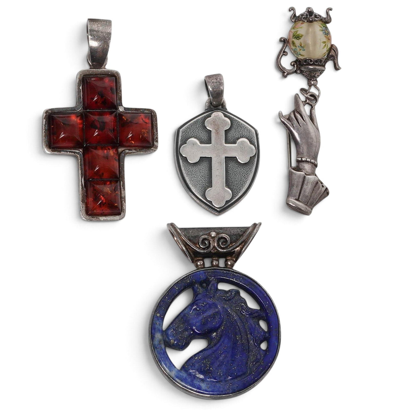 (4 Pcs) Sterling Silver & Gemstone Pendant/ BroochGroup: (4 Pcs) Sterling Silver & Gemstone Pendant/ BroochGroup Late 20th/21st century, Mixed origin Group of four pendants including an Offerings Jewelry by Sajen 925 sterling silver carved lapis lazuli hors