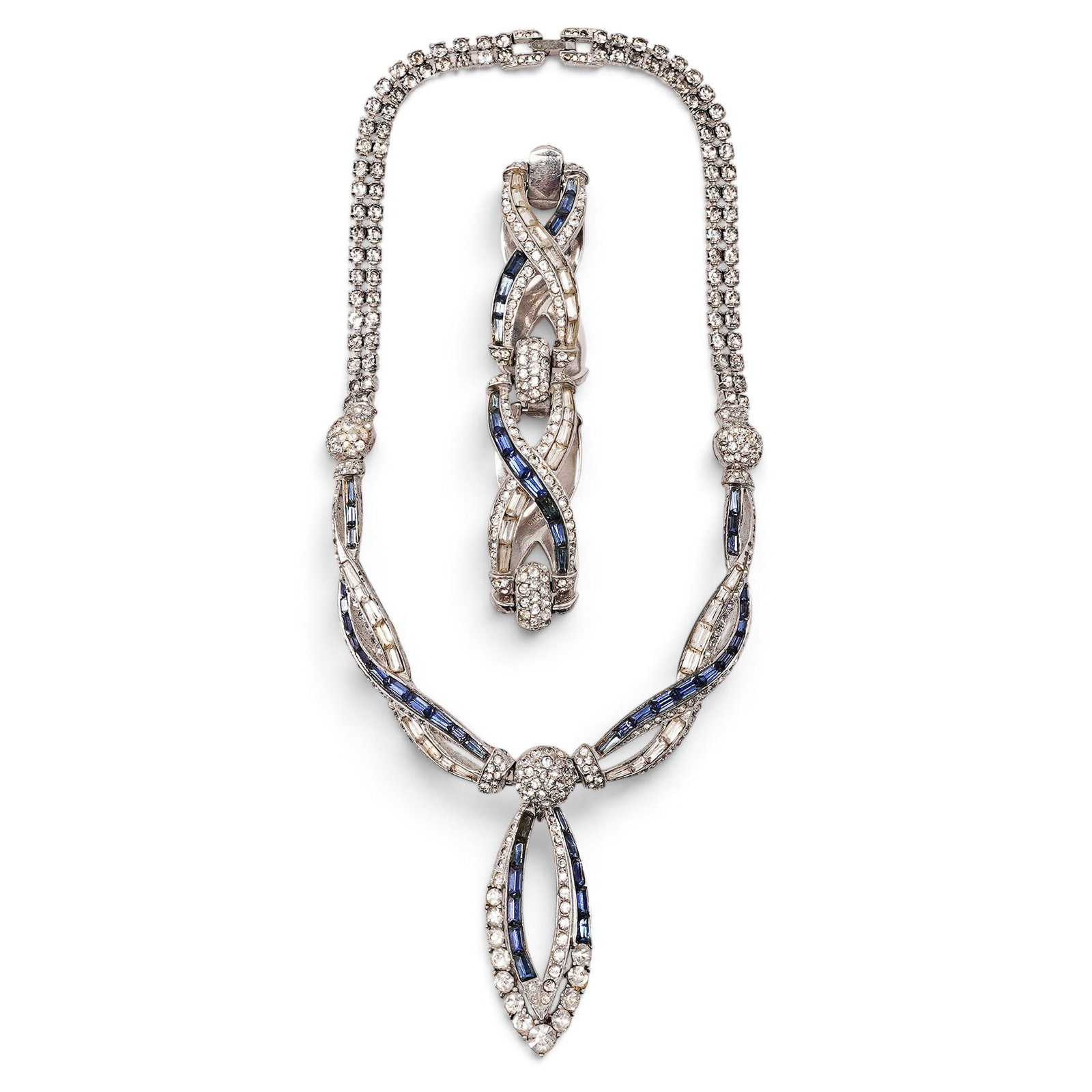 Boucher Sterling Silver Blue & Clear Rhinestone Necklace & Bracelet Set: Boucher Sterling Silver Blue & Clear Rhinestone Necklace & Bracelet Set 1950s, USA Sterling silver articulated necklace and bracelet set with interlacing links channel-set with blue and clear baguette