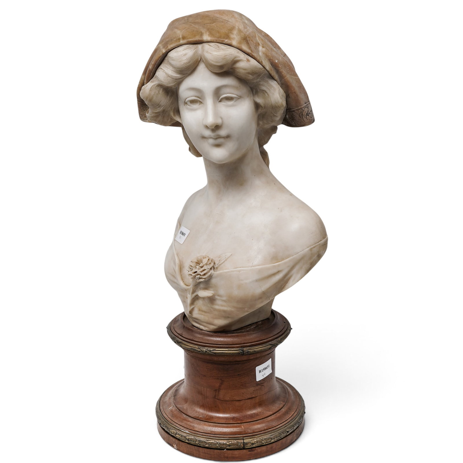 Adolfo Cipriani (Italian, 1857-1941) Alabaster and Marble Bust: Antique large Italian alabaster bust of a woman, created by sculptor Adolfo Cipriani. The sculpture features a young woman with a delicate bonnet or veil, a rose detail at her chest, and is mounted on