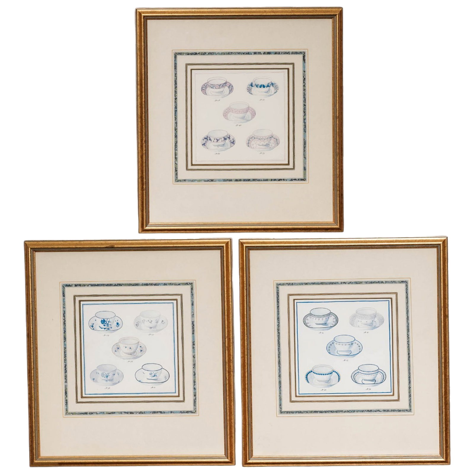 (3 pc) Vintage English Tea Cup Lithographs: (3 pc) Vintage English Tea Cup Lithographs 20th Century A set of three decorative lithographic plates depicting groupings of English teacups and saucers in delicate blue and gray tones. Each compositi