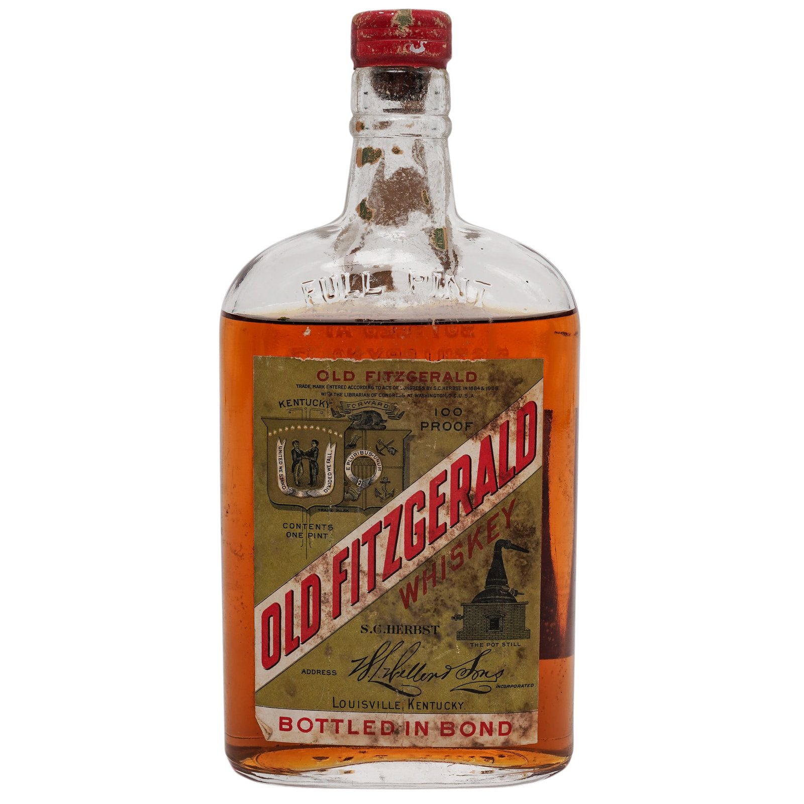 1915 Old Fitzgerald Bottled in Bond 100 Proof Bourbon Whiskey Bottle: 1915 Old Fitzgerald Bottled in Bond 100 Proof Bourbon Whiskey Bottle 1915, USA A vintage Old Fitzgerald Bottled in Bond Kentucky Straight Bourbon Whiskey bottle retaining its original paper labels. Th