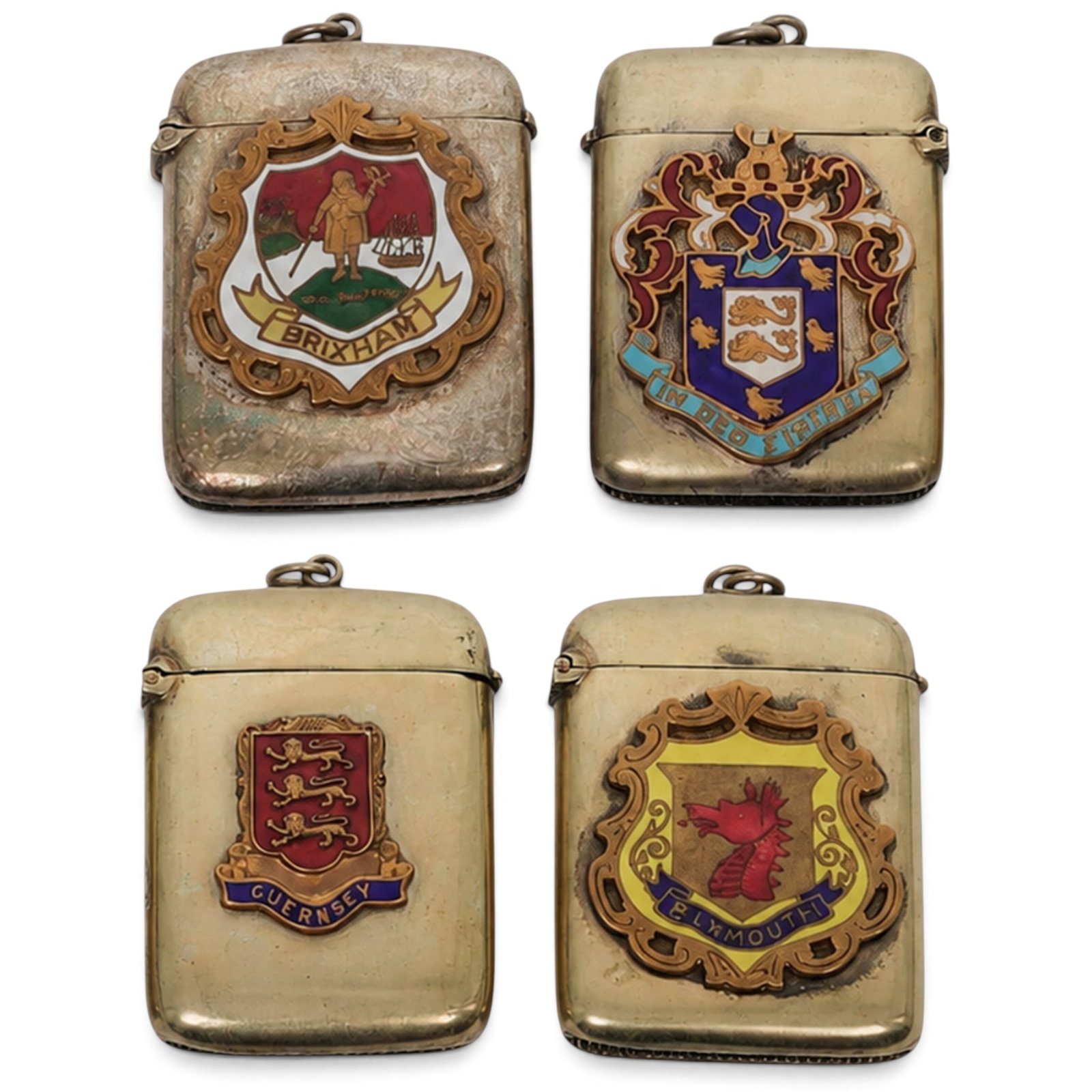 (4 pcs) English Heraldic Silver Plated Match Safes: (4 pcs) English Heraldic Silver Plated Match Safes Early 20th century, English (4 pc) Edwardian silver plated match safes (1) Guernsey featuring enameled Coat of Arms. Includes original matches. Measu