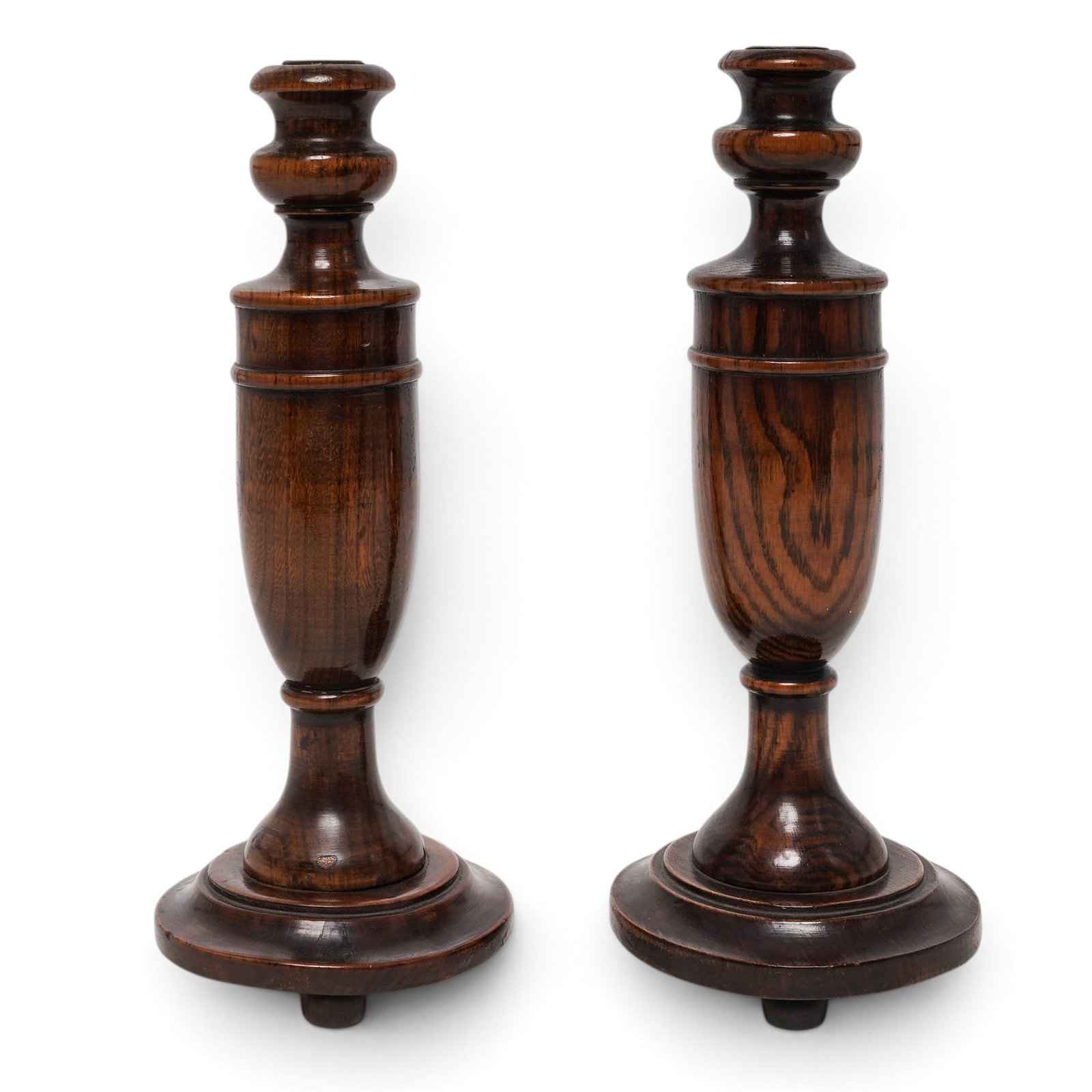 Edwardian Hand-Turned Oak Candlesticks: Edwardian Hand-Turned Oak Candlesticks c. 1900-1940s, England Antique hand-turned dark oak candlesticks. These classic home decor items feature a rich, prominently visible wood grain, a
