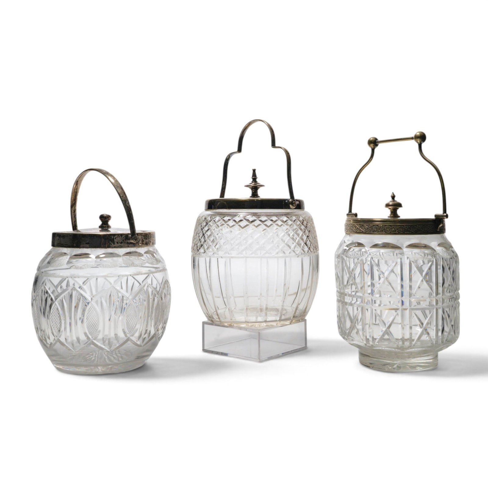 (3 pc) Antique Cut Crystal & Silver Plated Biscuit Barrels: (3 pc) Antique Cut Crystal & Silver Plated Biscuit Barrels Late 19th Century, England A group of three cut crystal biscuit barrels with silver plate mounts and lids. Includes one example with a distin