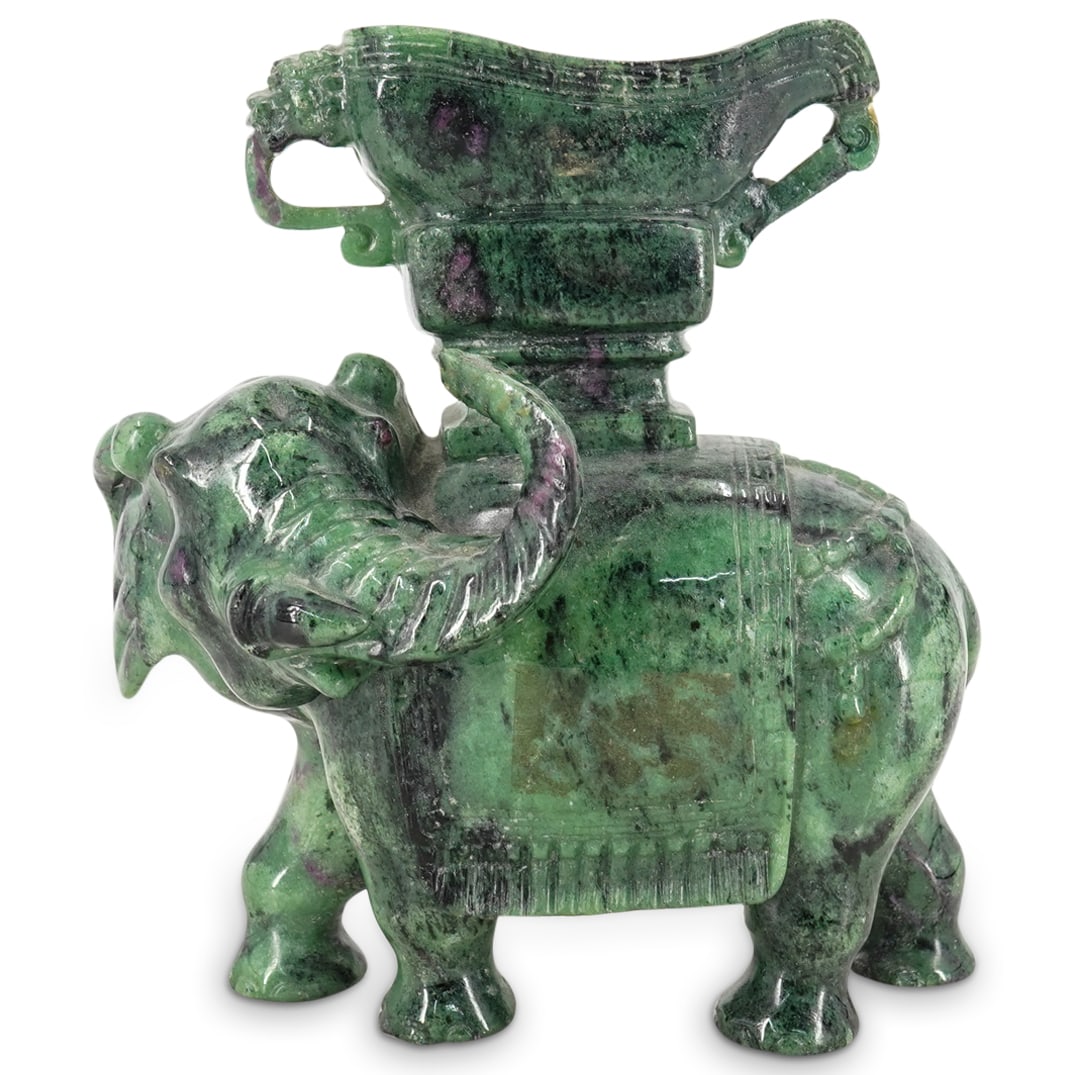 Antique Chinese Chloromelanite Jade Elephant With Vessel: Antique Chinese Chloromelanite Jade Elephant With Vessel 19th Century, possibly older, China Chloromelanite jade elephant carrying a vessel on its back. Elephant is robed in elaborate garments and bea