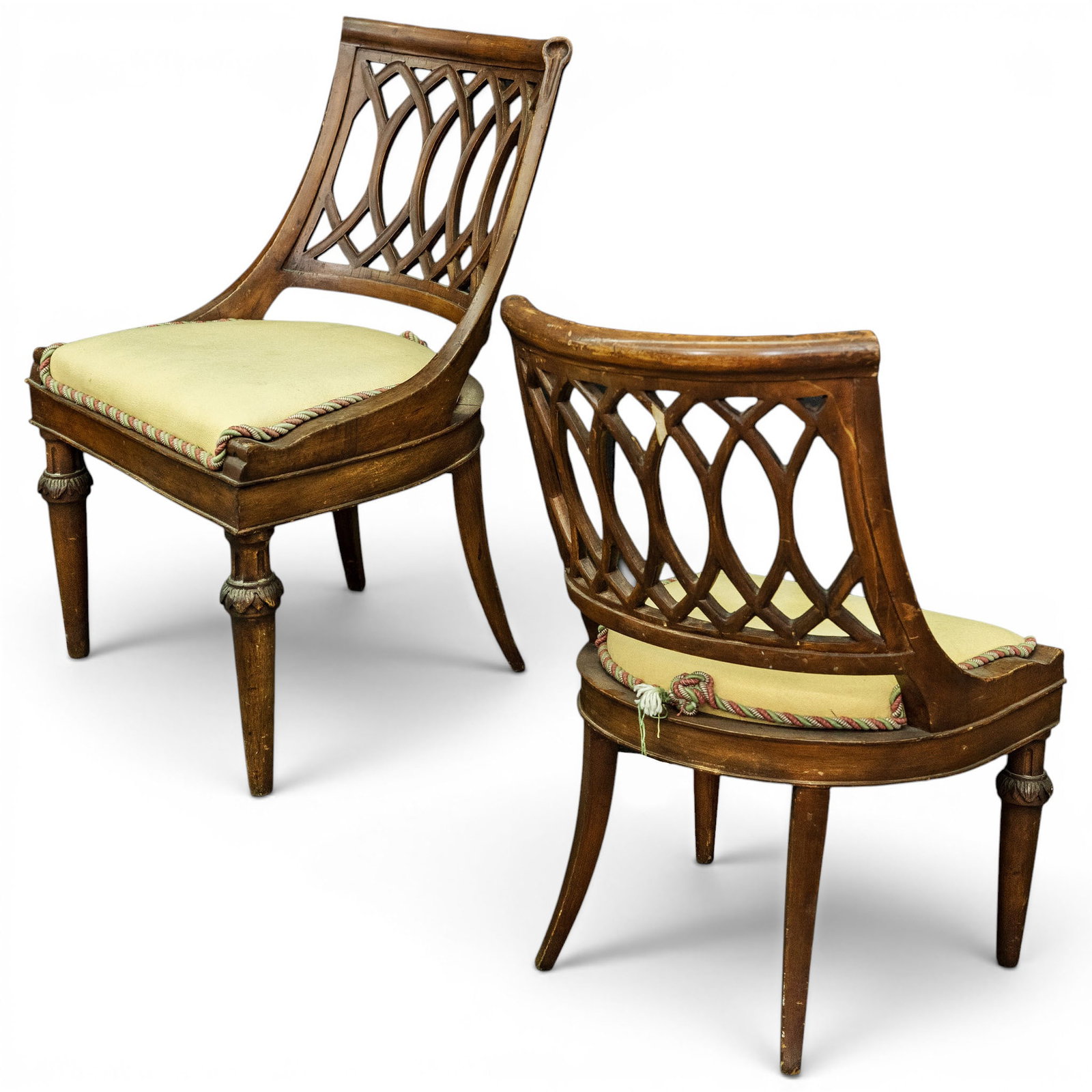 Pair of Antique Italian Neoclassical Trellis-Back Chairs: Pair of Antique Italian Neoclassical Trellis-Back Chairs Mid-20th Century, Italy A matched pair of carved walnut side chairs with shaped crest rails and pierced interlaced Gothic-inspired openwork bac
